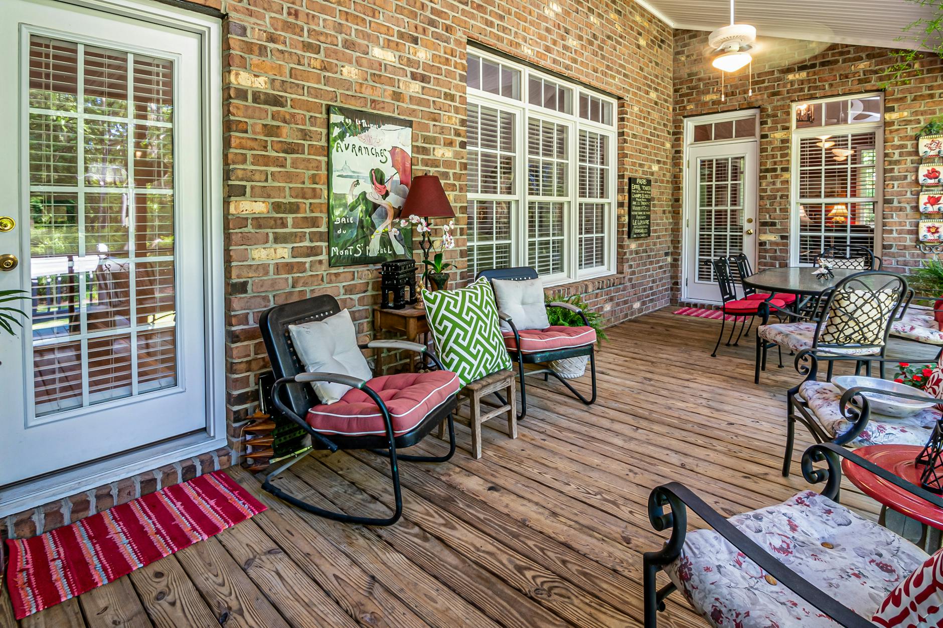 Comfortable patio seating area on a brick patio with natural wood elements