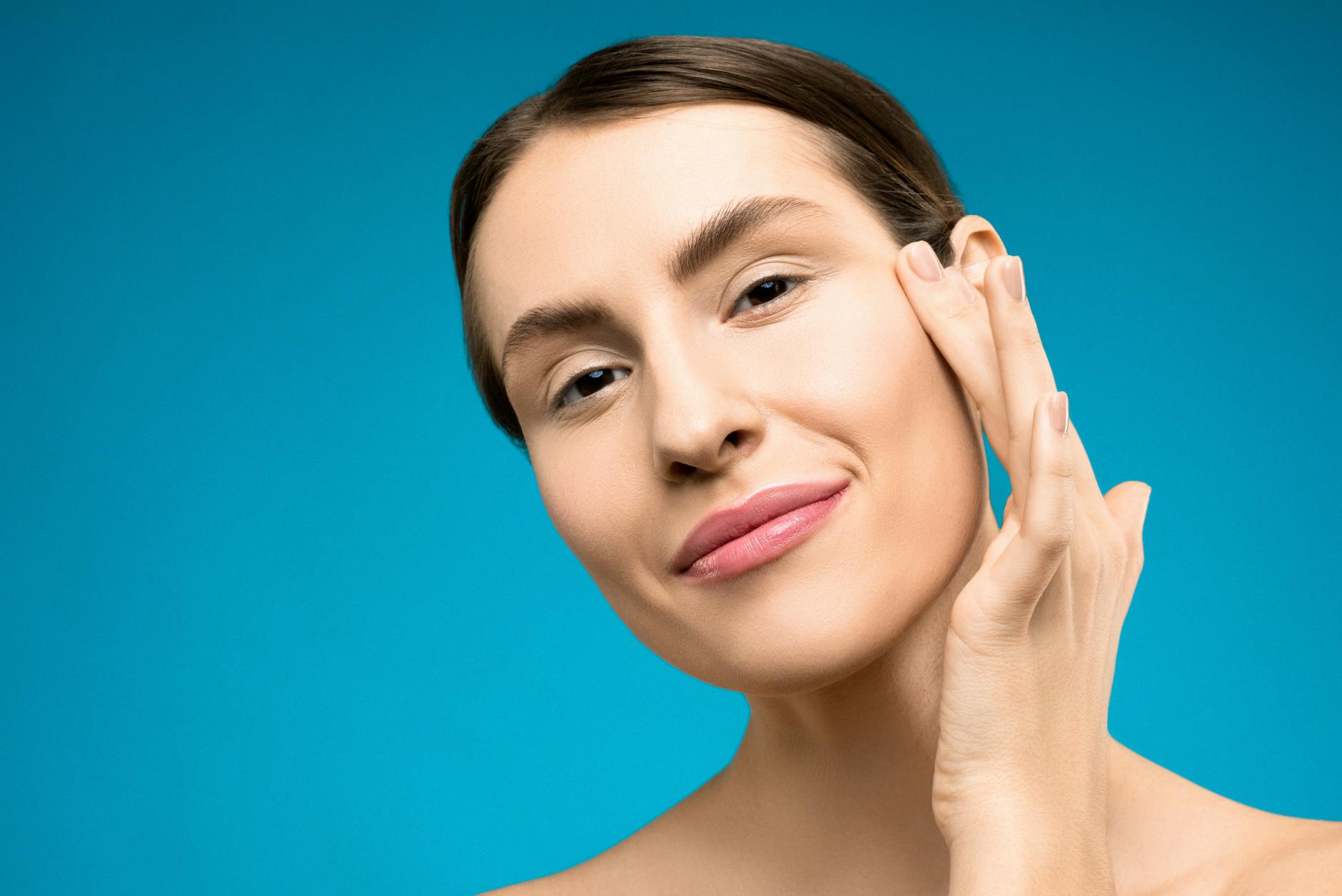 Confident Skin After Consistent Acne Scar and Hyperpigmentation Treatment Woman with confident, glowing skin after consistent skincare treatment for acne scars and hyperpigmentation