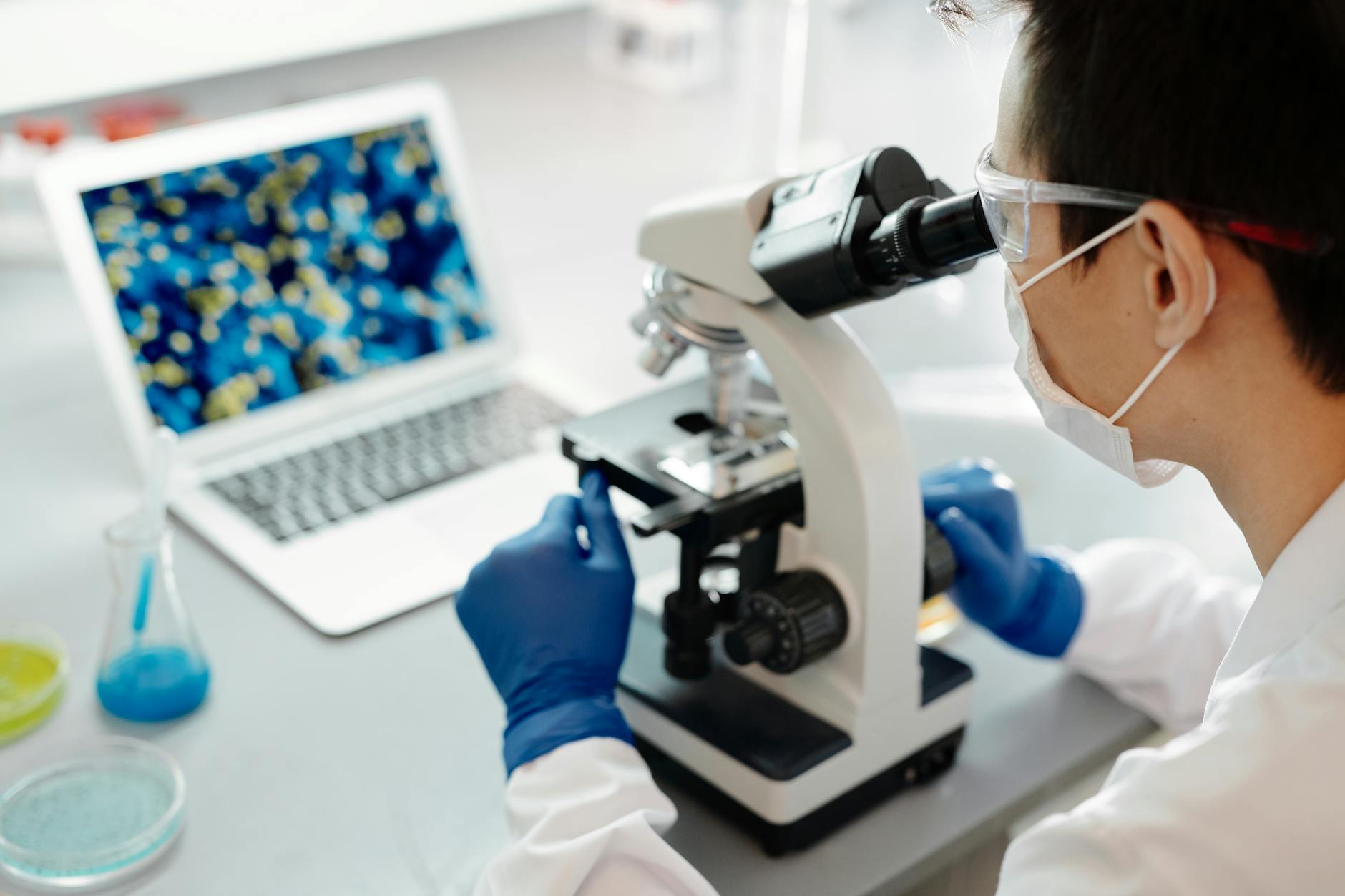 Gut Microbiome Research Laboratory 2026 Scientist examining samples under a microscope in a laboratory setting, conducting gut microbiome and Akkermansia muciniphila research