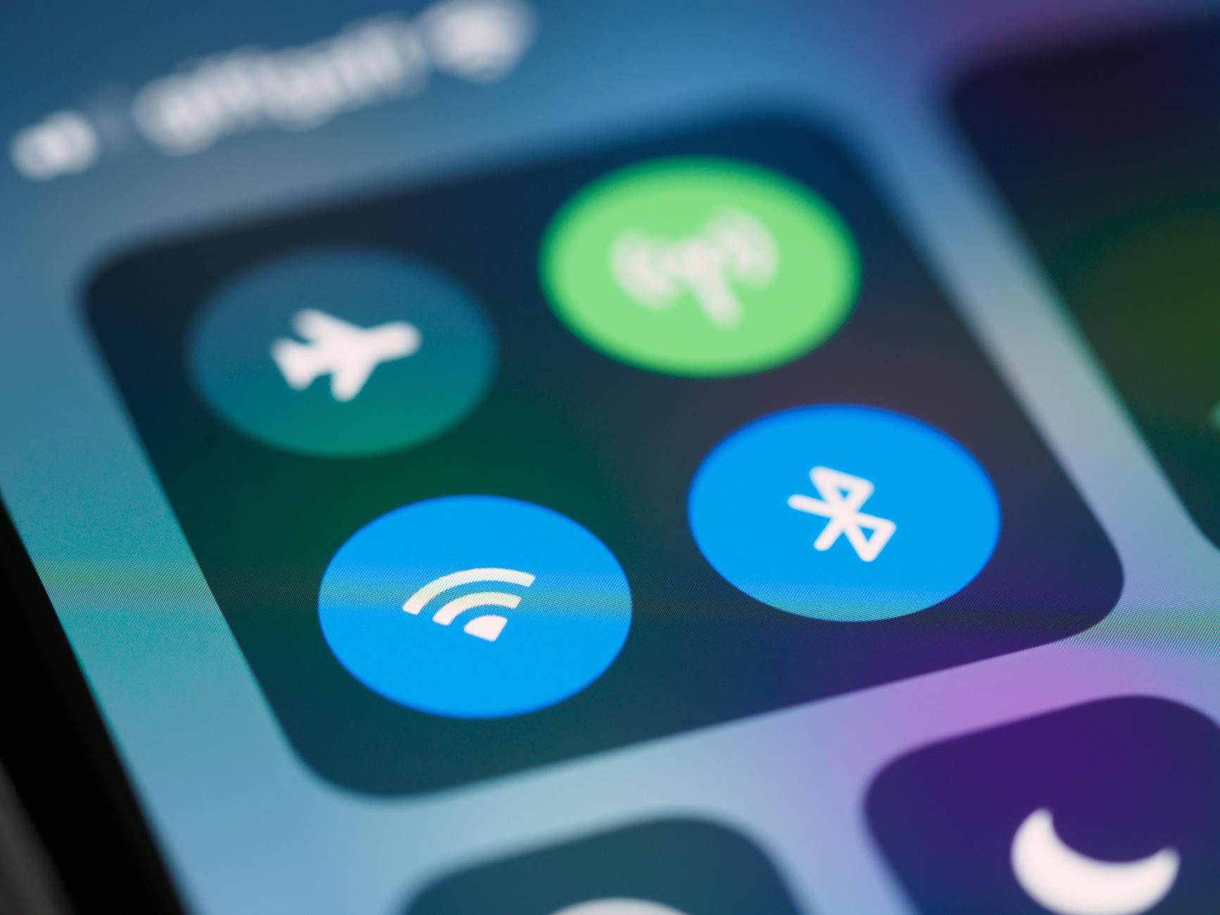 Bluetooth Connectivity — Apple Find My Network Technology Smartphone control panel showing Bluetooth and Wi-Fi connectivity icons used by the Find My network