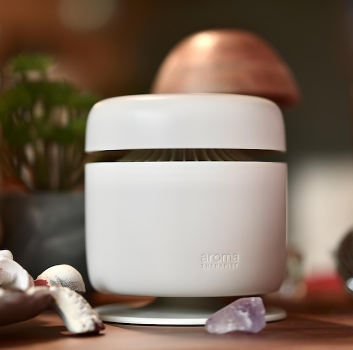 AromaAmplifier flameless diffuser in use in a modern living room