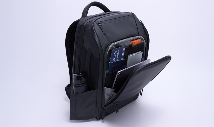 AVIO APEX Travel Backpack In-Use 2026 AVIO APEX travel backpack being worn and used in a travel setting