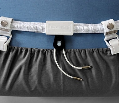 Bed Scrunchie 360-degree sheet tightening system laid out flat showing bungee cord and gripper clips