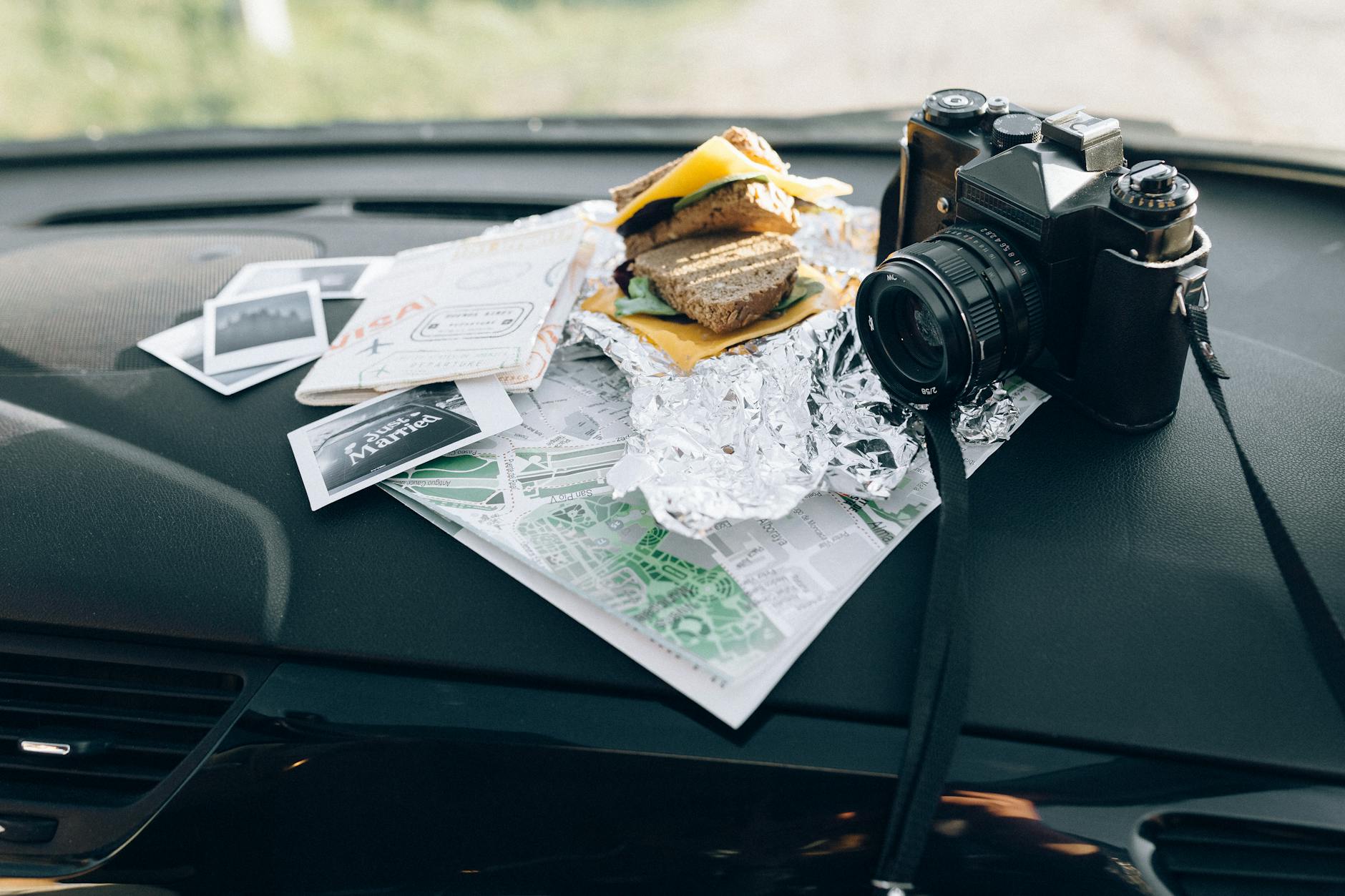 Car Food Tray Road Trip Setup 2026 Travel snacks and gear laid out in car interior — perfect use case for a car food tray