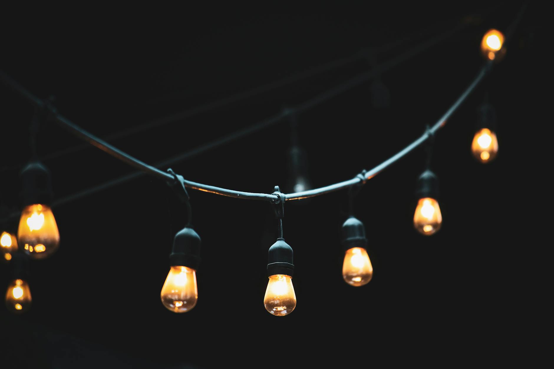 Patio String Lights Ambiance - Outdoor Entertaining Gift Ideas Warm glowing string lights creating ambient backyard atmosphere at night