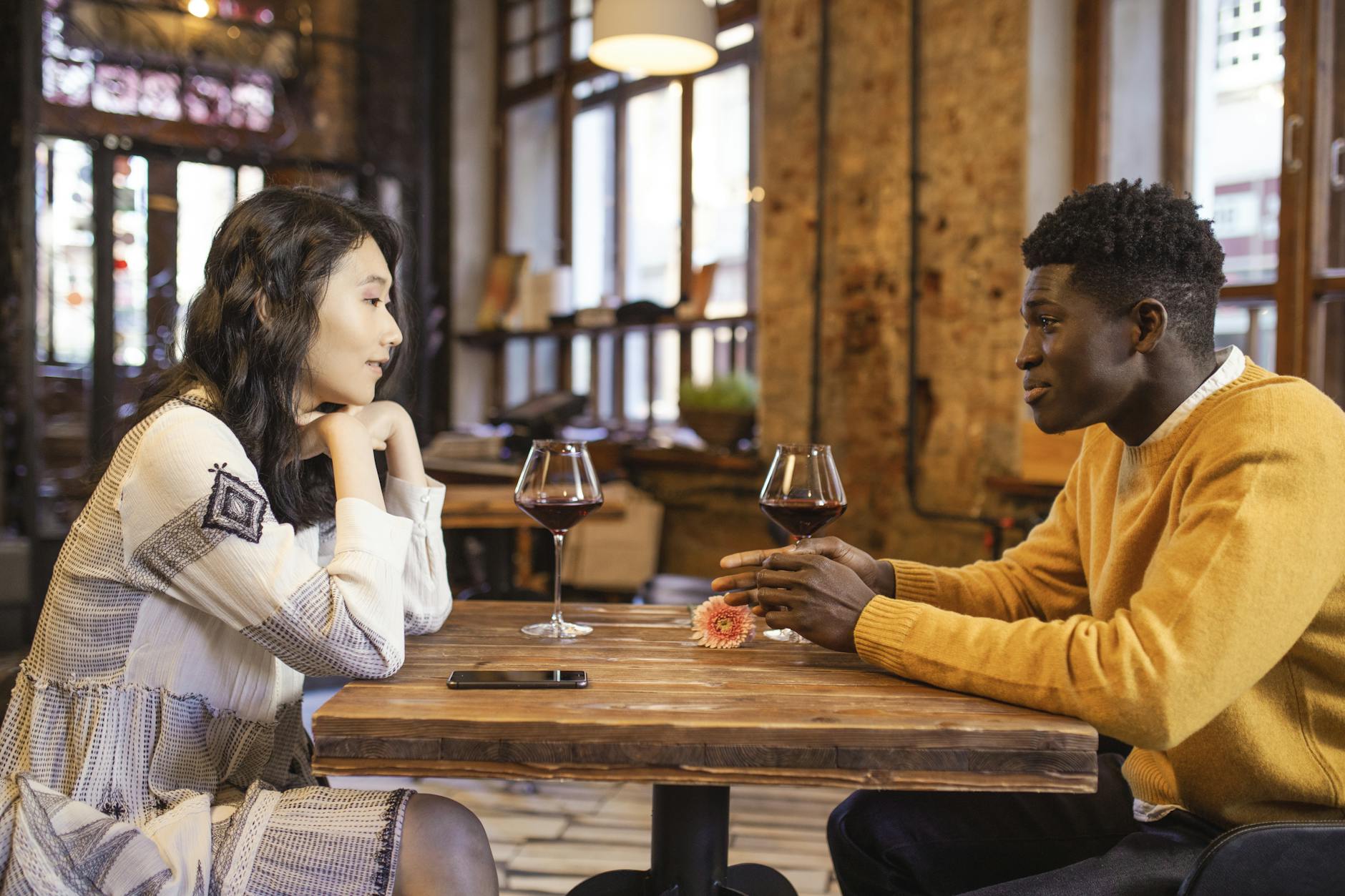 Confidence Around Women — Conversation and Connection A man and woman engaged in confident, relaxed conversation at a café