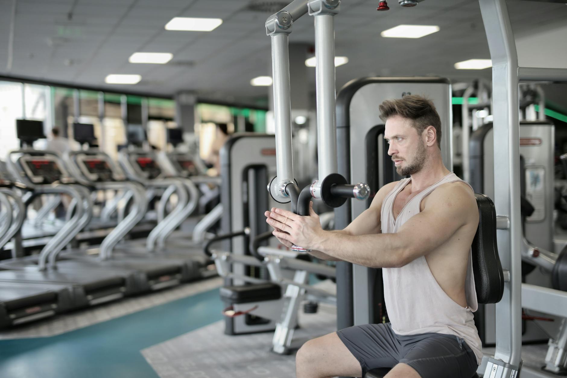Fitness and Strength Training for Male Confidence A man lifting weights at the gym, building physical confidence and strength