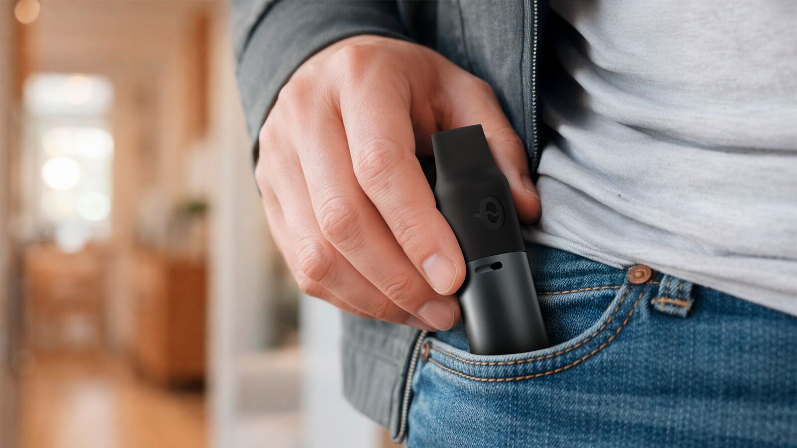 Man holding CAPNOS Legura with thoughtful expression — considering a nicotine-free vape alternative