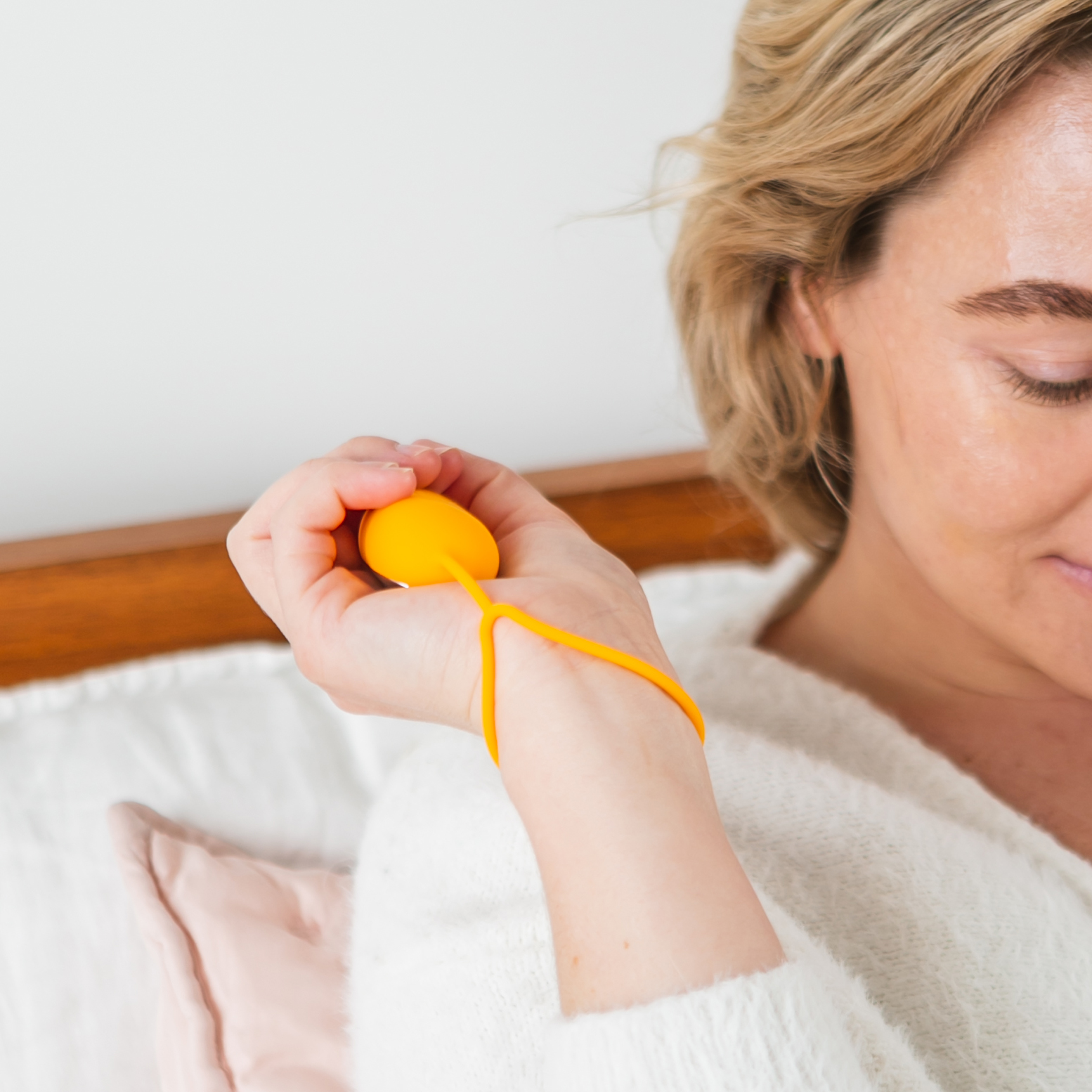 Woman holding Chill Pill near face with 5-star rating overlay and text about calming the mind and body
