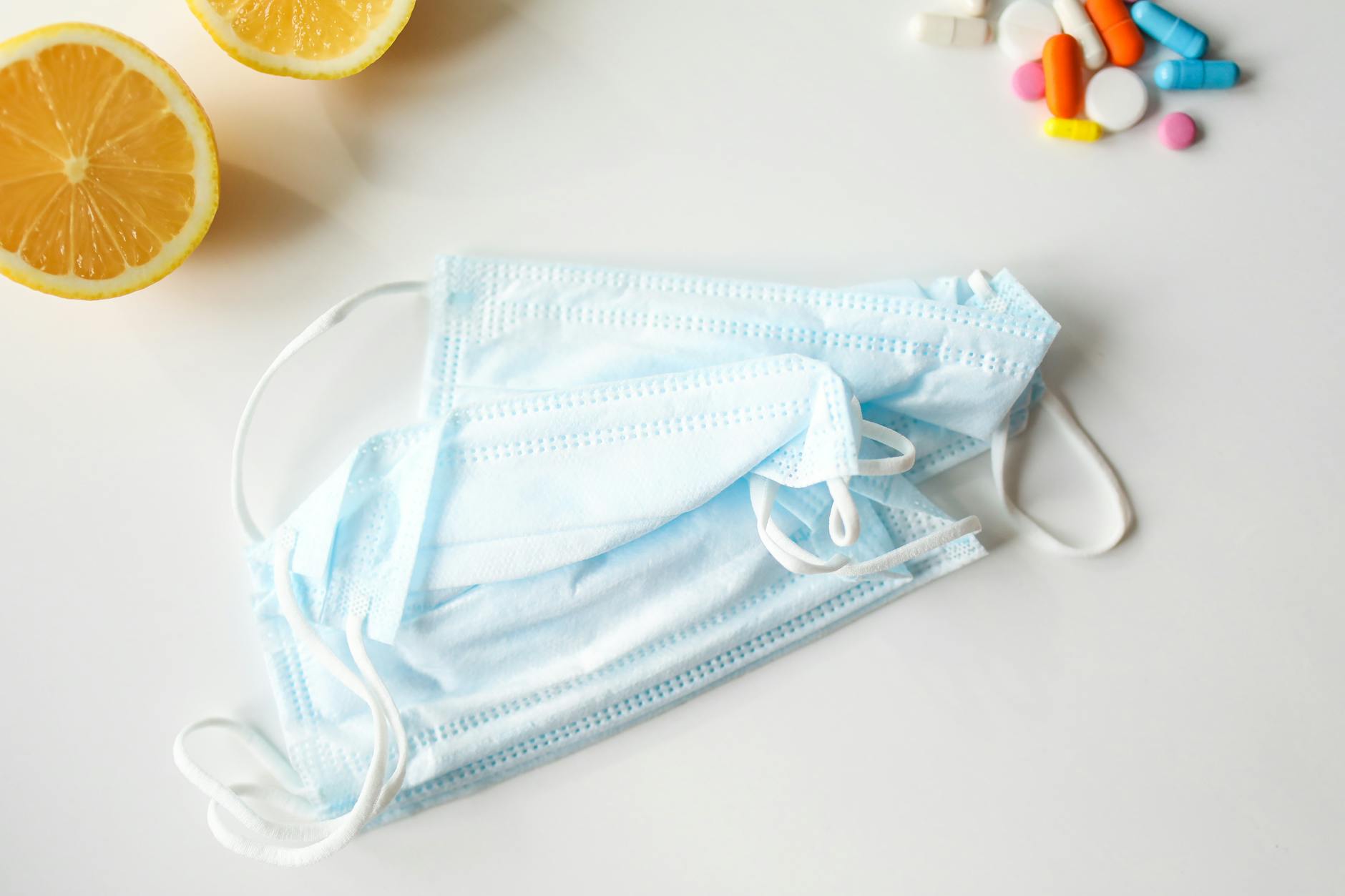 Immune System Health and Anti-Inflammatory Protection Health and immunity concept with face masks, lemons and supplements representing immune system support