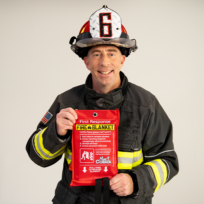 Professional firefighter endorsing the Cobra Fire Blanket for home use