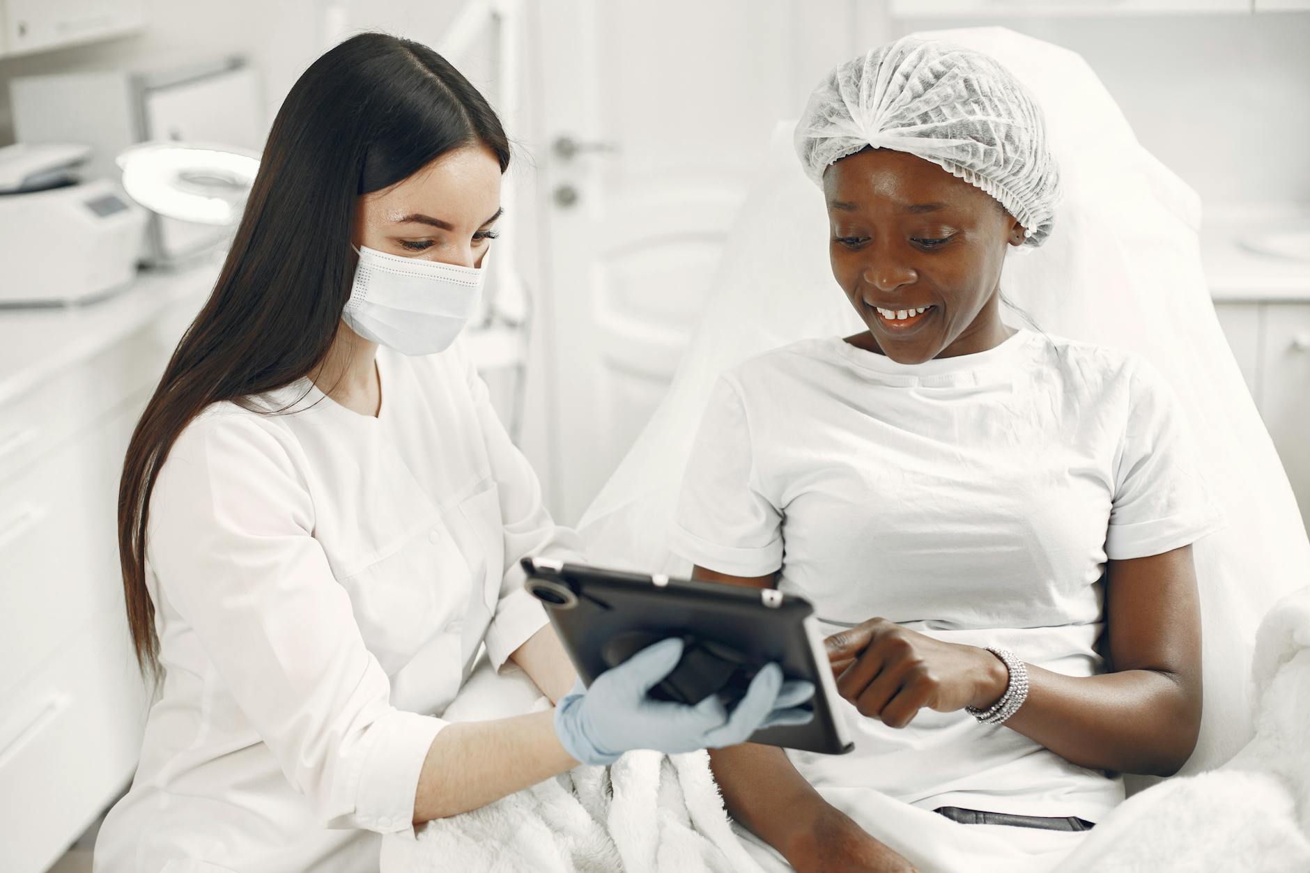 Dermatologist consulting with patient about skincare treatment options