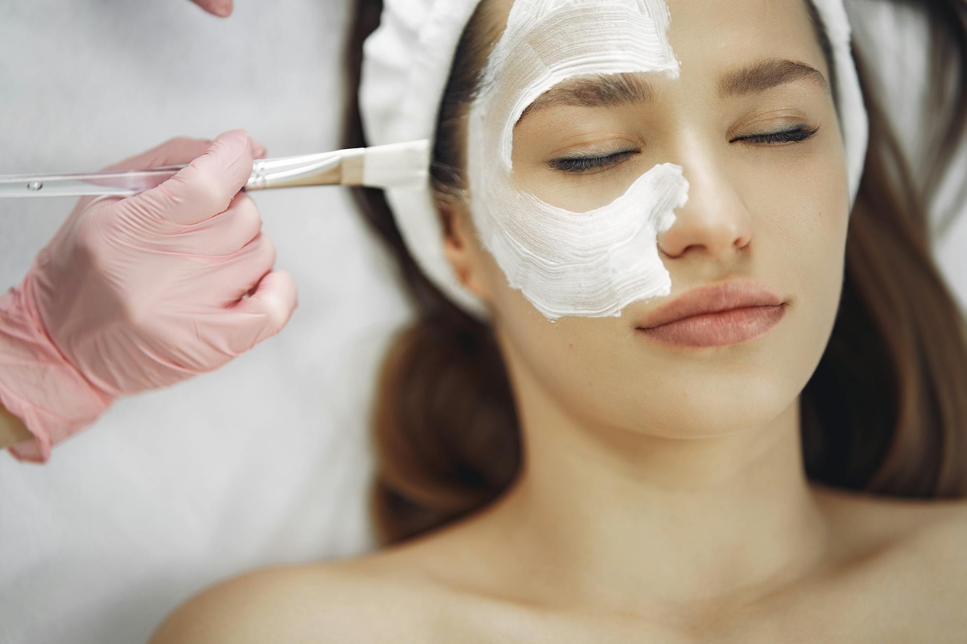 Professional spa facial skincare treatment with mask being applied