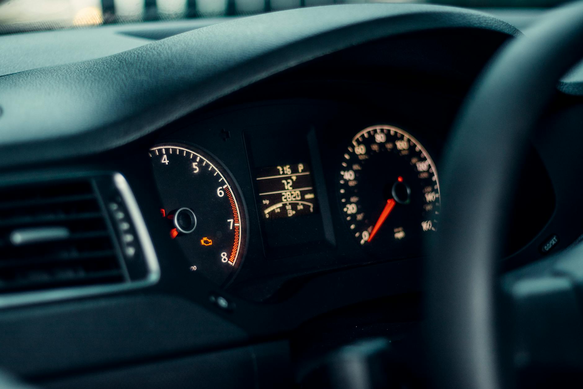 Clear, uncluttered car dashboard showing gauges — a well-organized vehicle interior supports focused driving