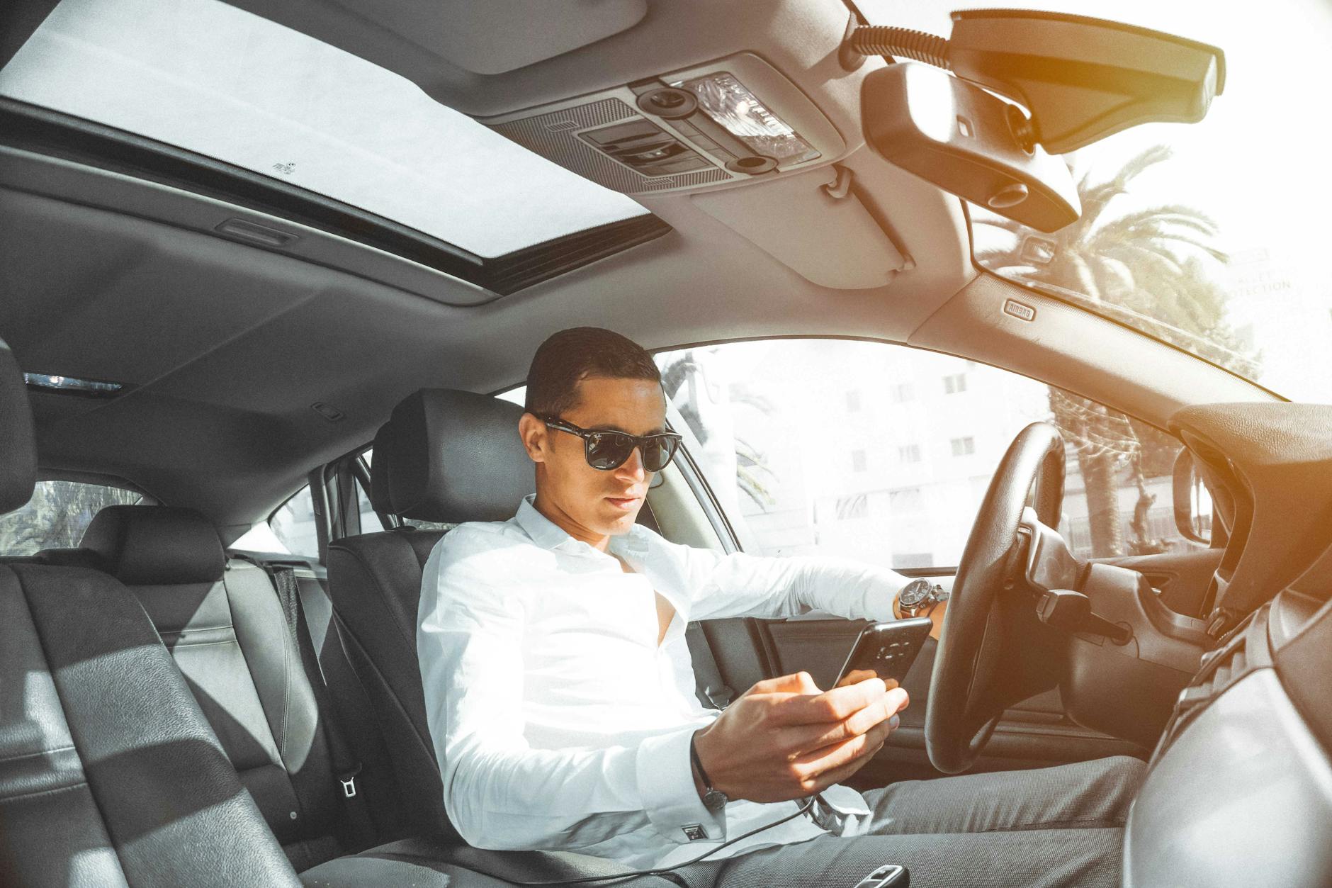 Driver distracted by a handheld device while driving — a common and preventable form of distracted driving