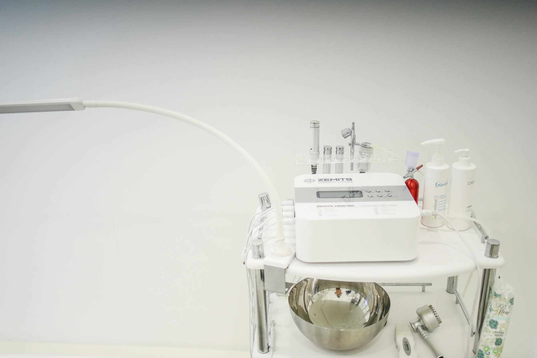 High-tech skincare device setup for microcurrent facial treatment in a professional clinic