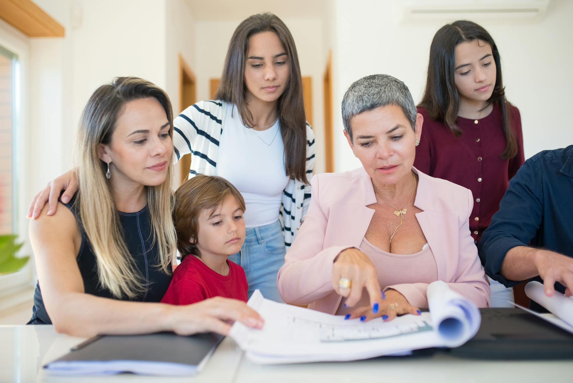 Family reviewing estate planning documents together with advisor