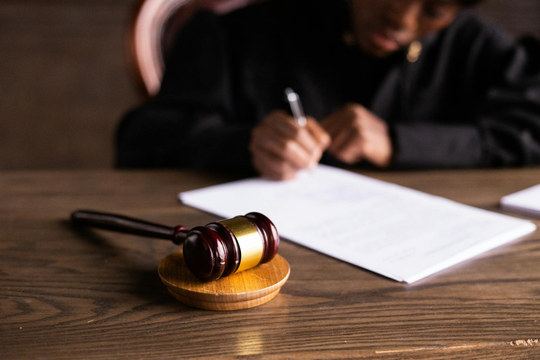 Legal documents being reviewed and signed during estate planning process