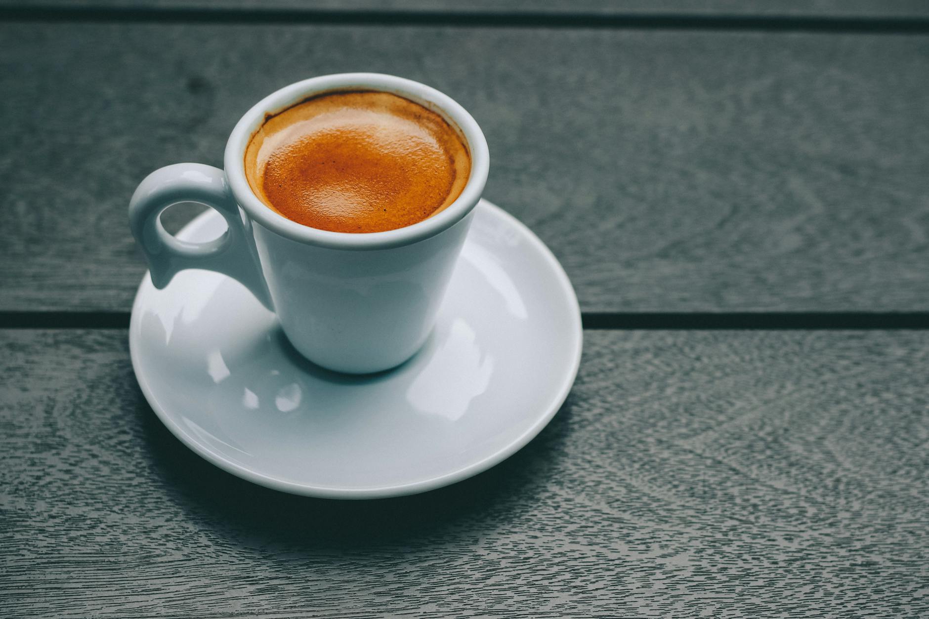 A shot of espresso in a porcelain cup — one of the leading causes of extrinsic tooth staining