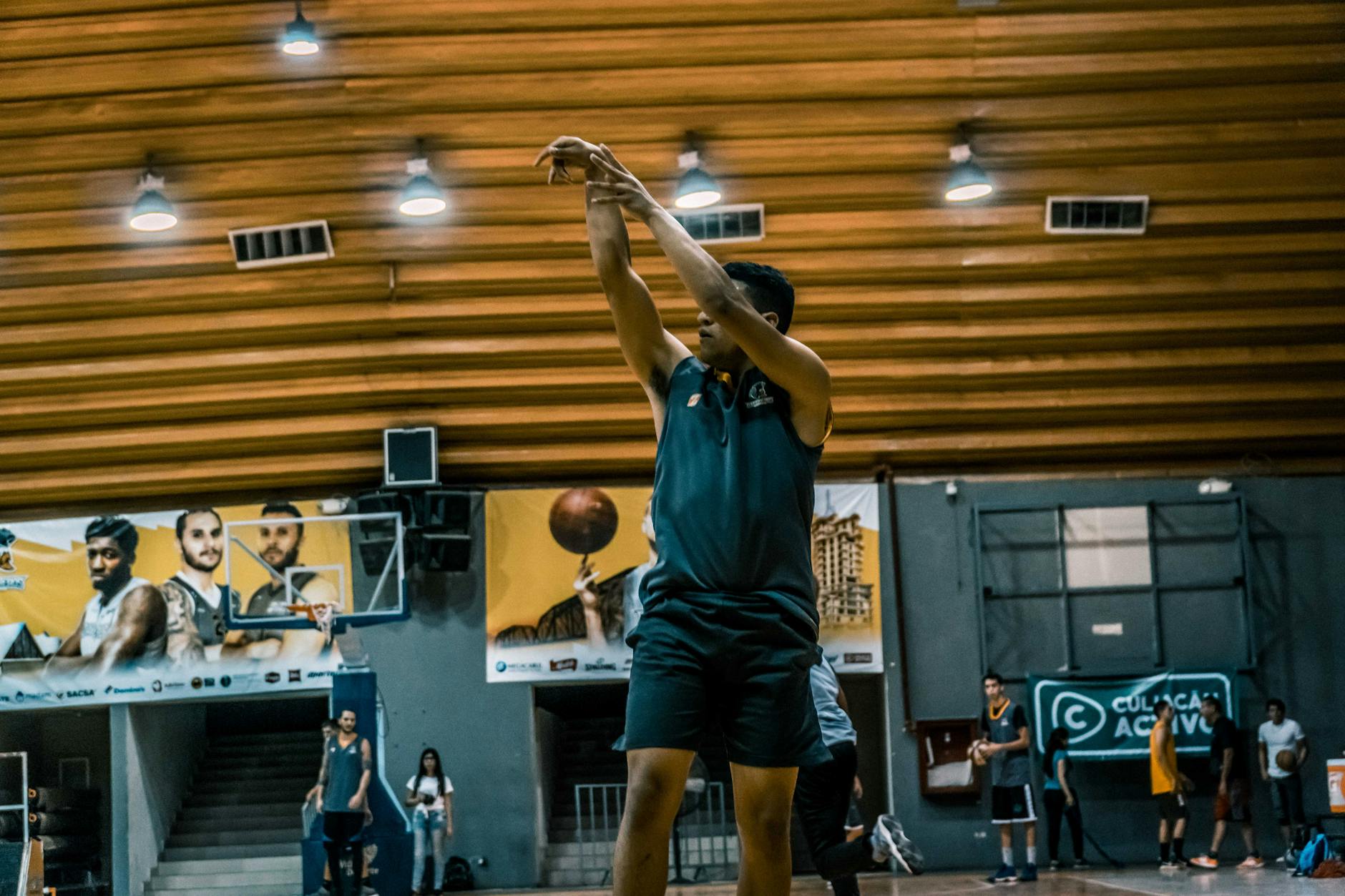 Warriors Basketball Player Development Practice 2026 Basketball player practicing shots in a gym — the kind of dedicated work that defines Warriors player development