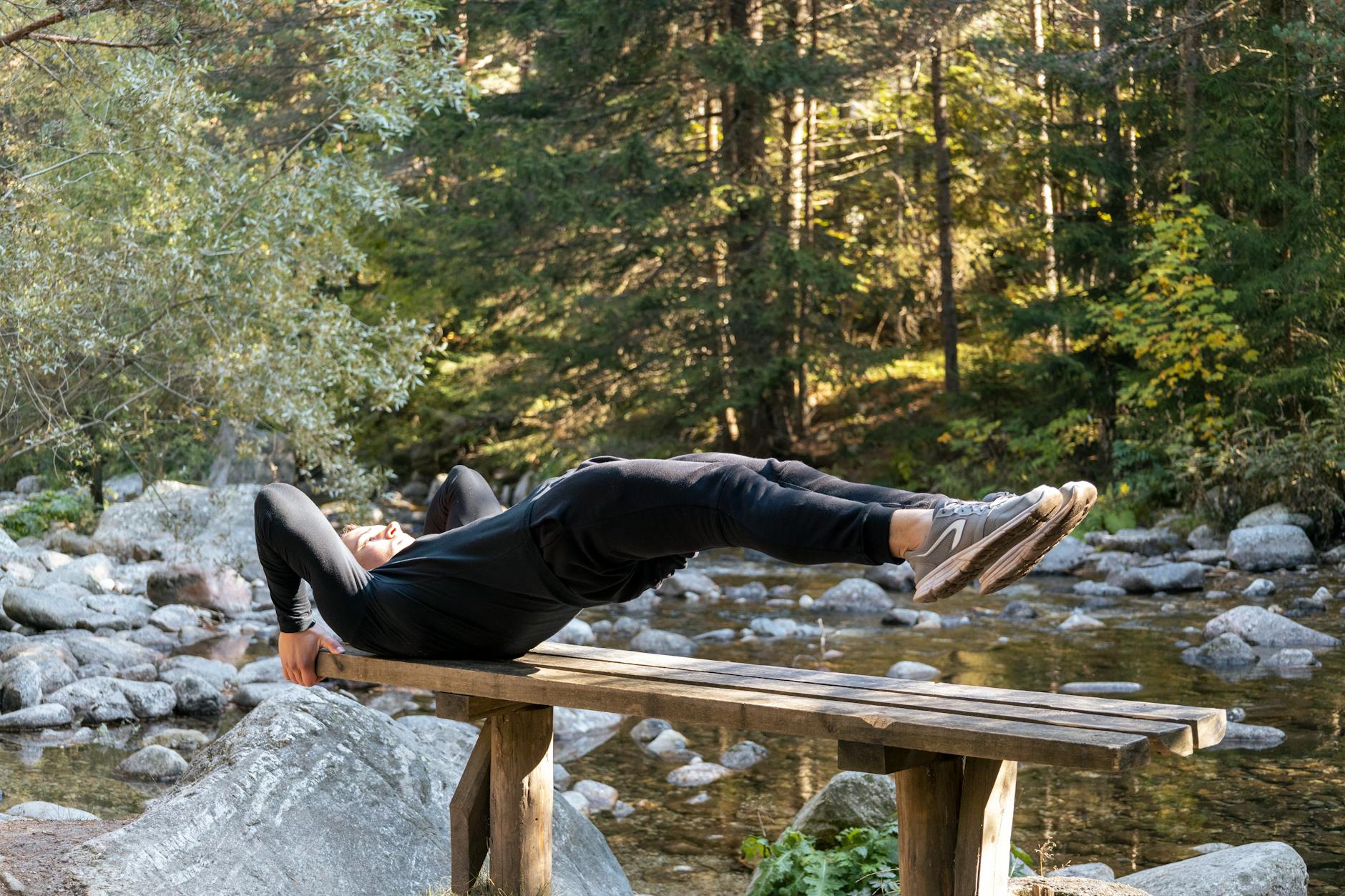 Athlete performing a core exercise outdoors — essential training for golf rotational power