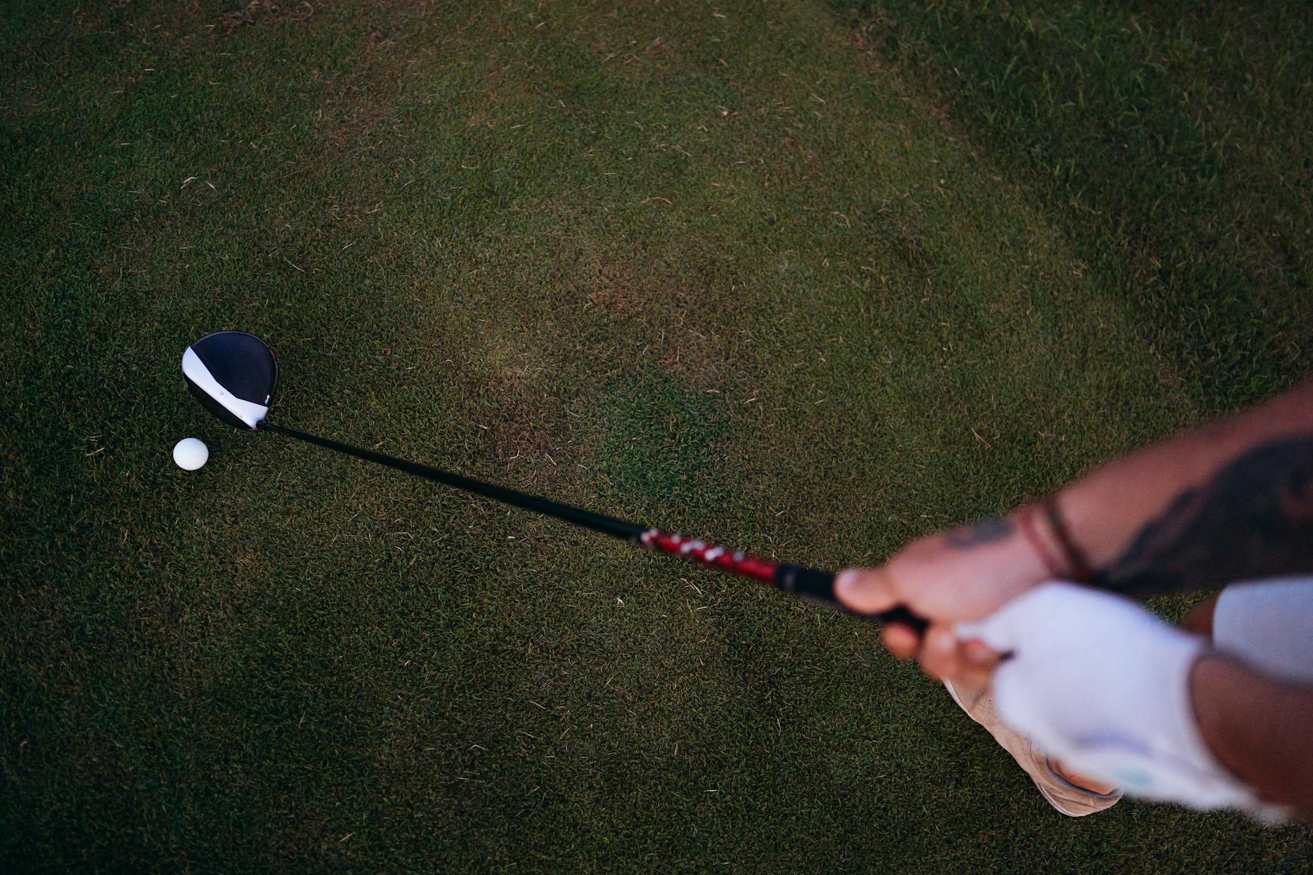 Golfer Setting Up for a Tee Shot 2026 Golfer preparing to swing driver on a golf course