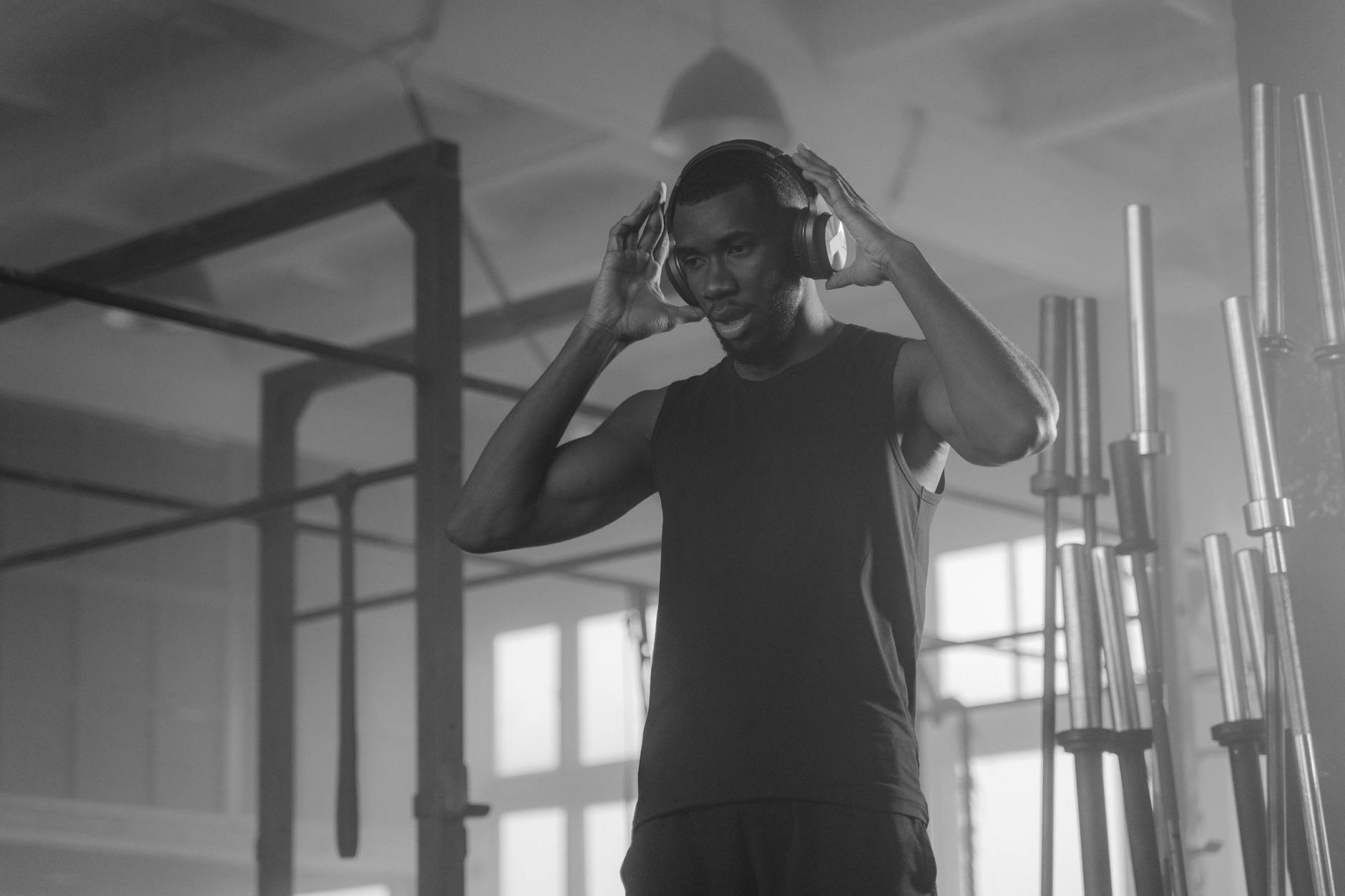 Athlete wearing headphones at the gym during a workout session