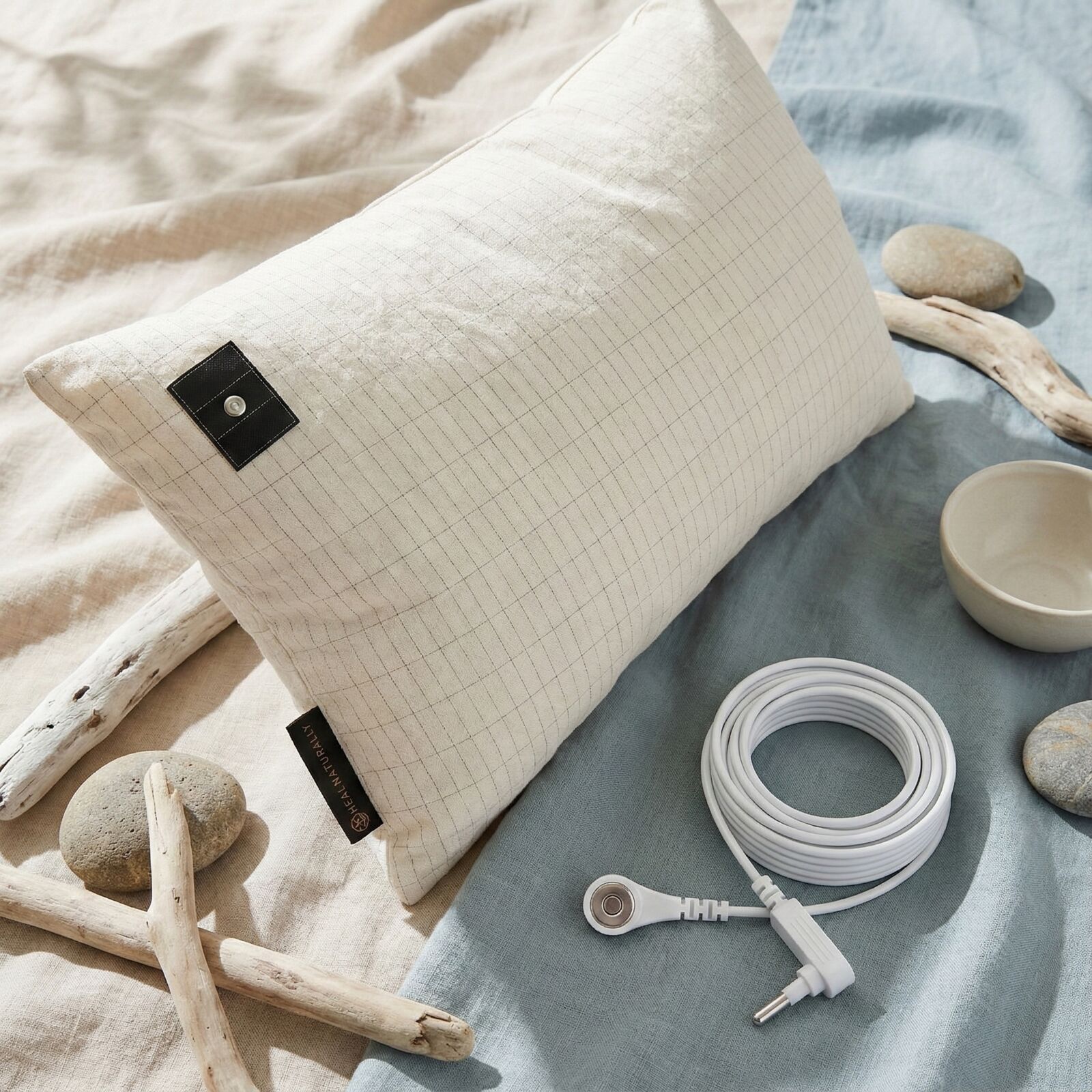 Grounding sheet connection point showing silver fiber snap connector setup