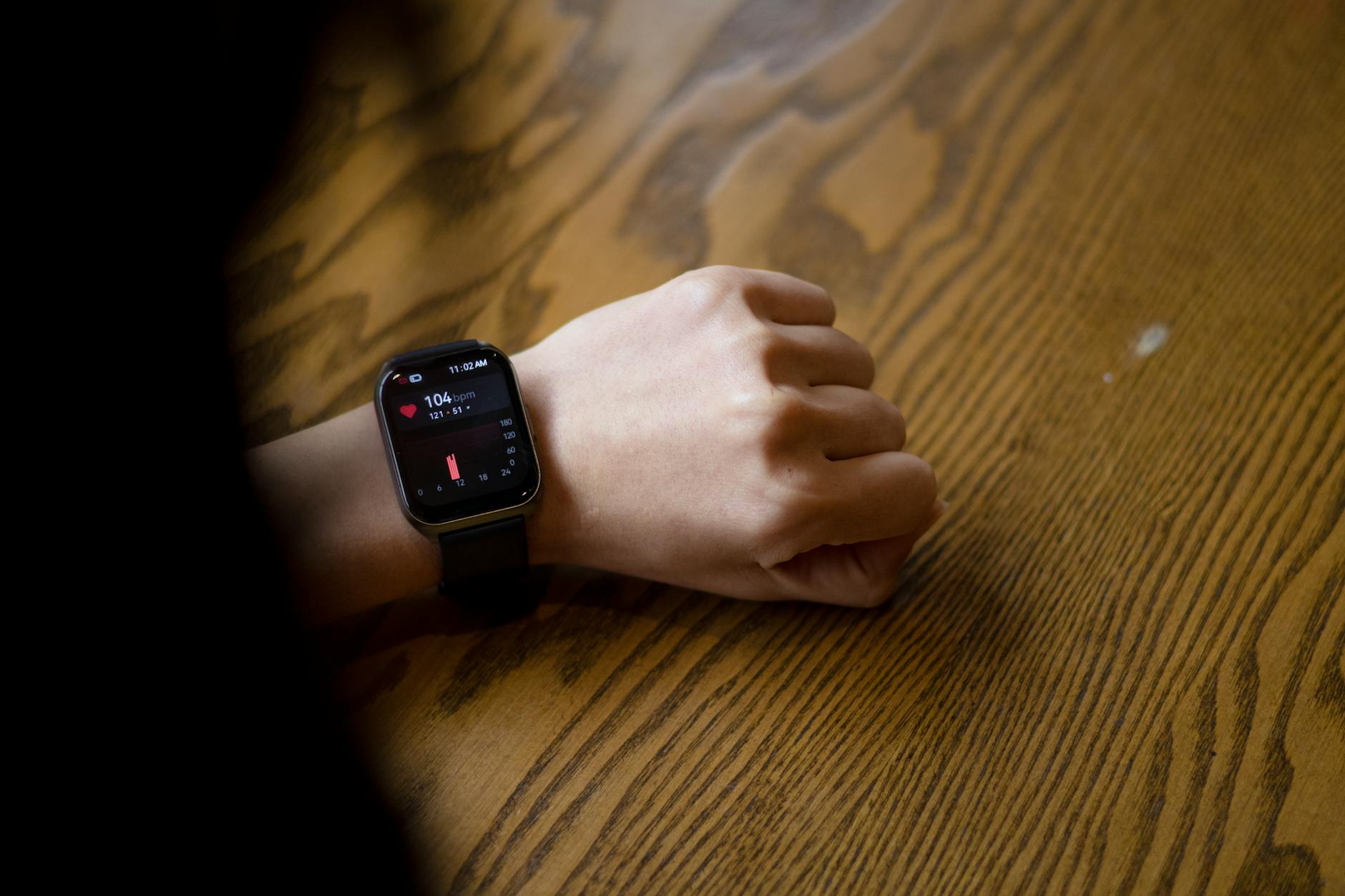 Person checking heart rate data on a smartwatch — heart rate variability monitoring