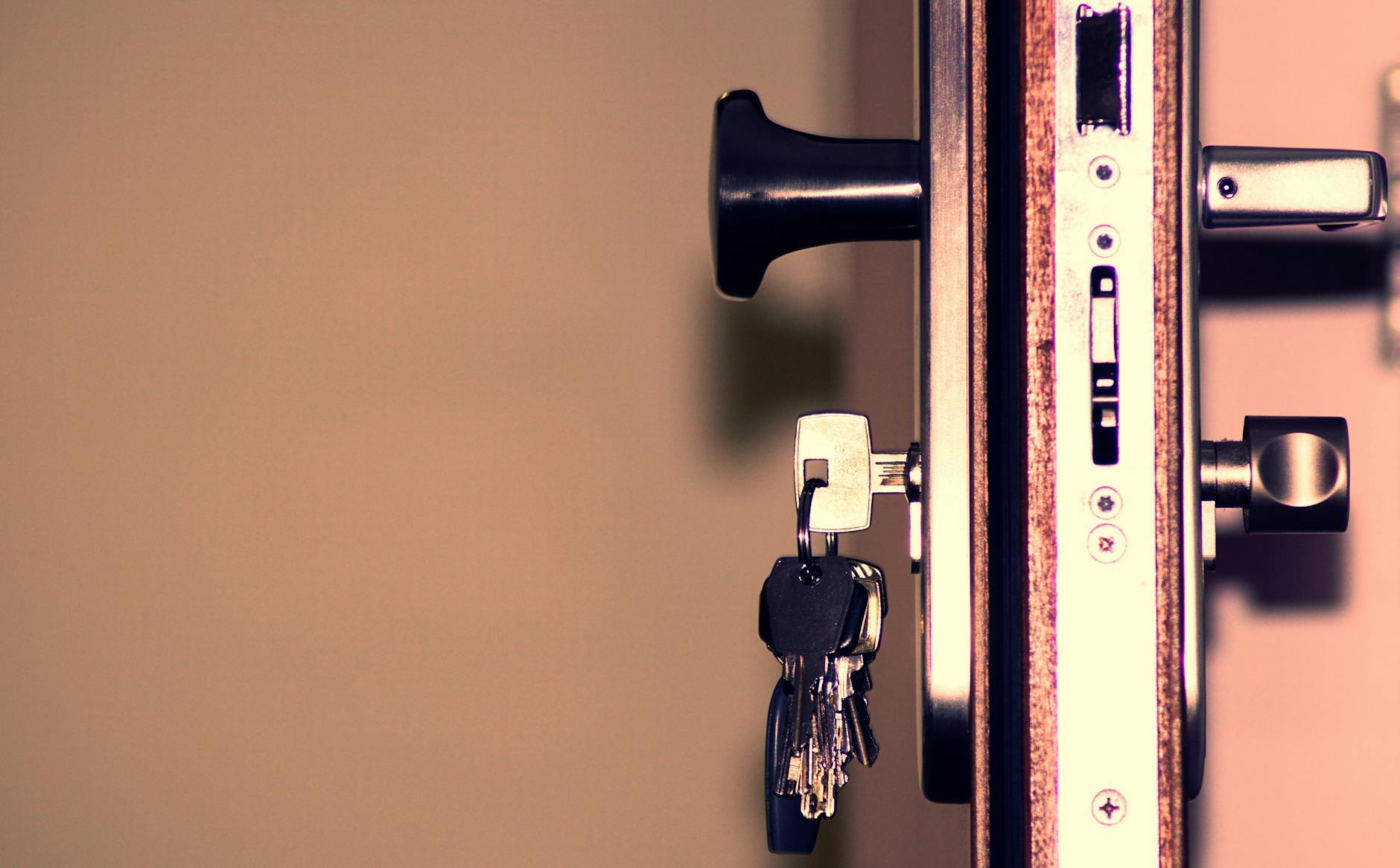 Close-up of a door lock with keys — the first line of home security