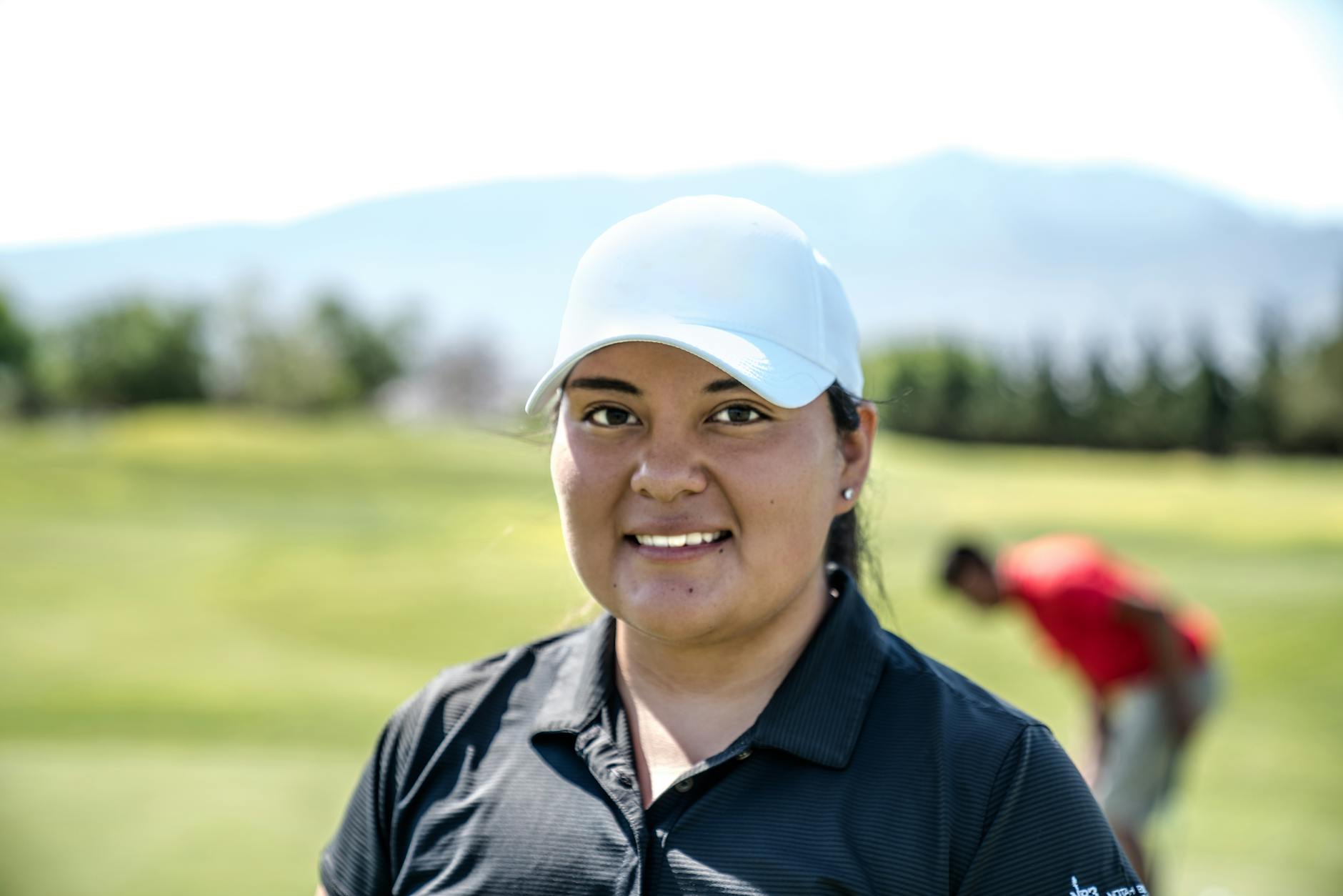 Woman golfer on a sunny fairway preparing for her next shot
