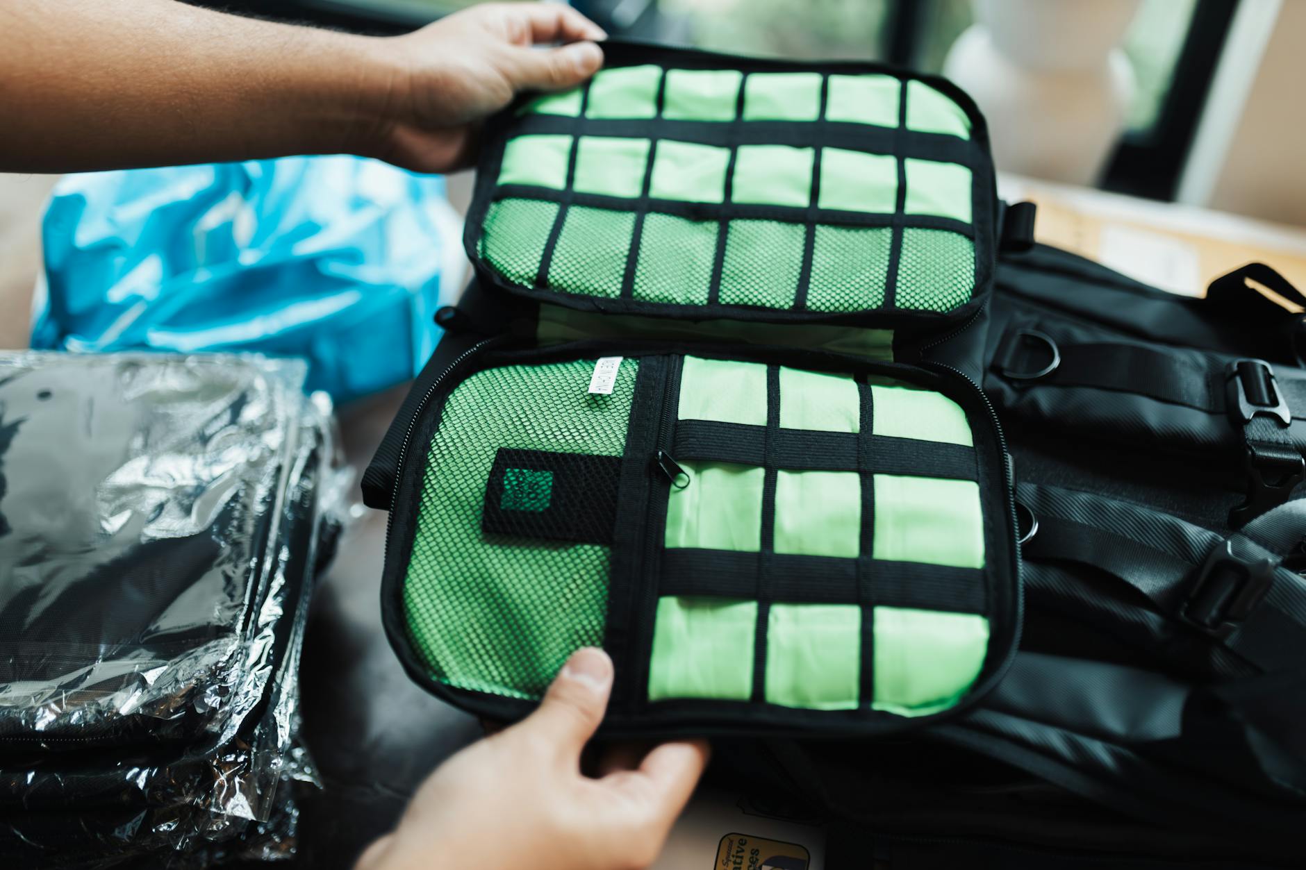 How to Pack a Carry-On Bag with Packing Cubes 2026 Hands organizing a carry-on suitcase with packing cubes for efficient travel packing