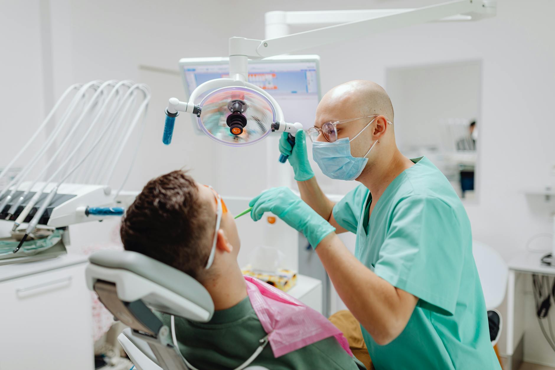 Dentist performing professional teeth cleaning and scaling to remove hardened tartar buildup