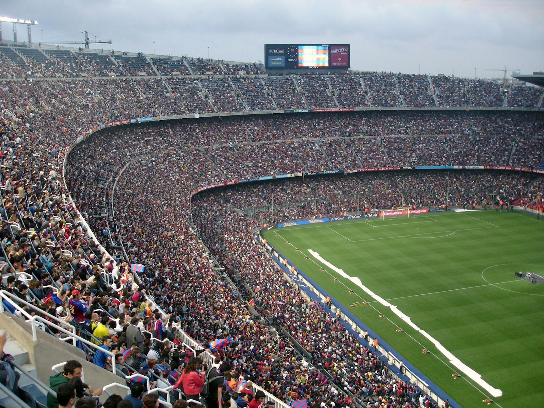 Champions League Fan Guide 2026 - Stadium Atmosphere Packed stadium with tens of thousands of football fans creating a vibrant matchday atmosphere
