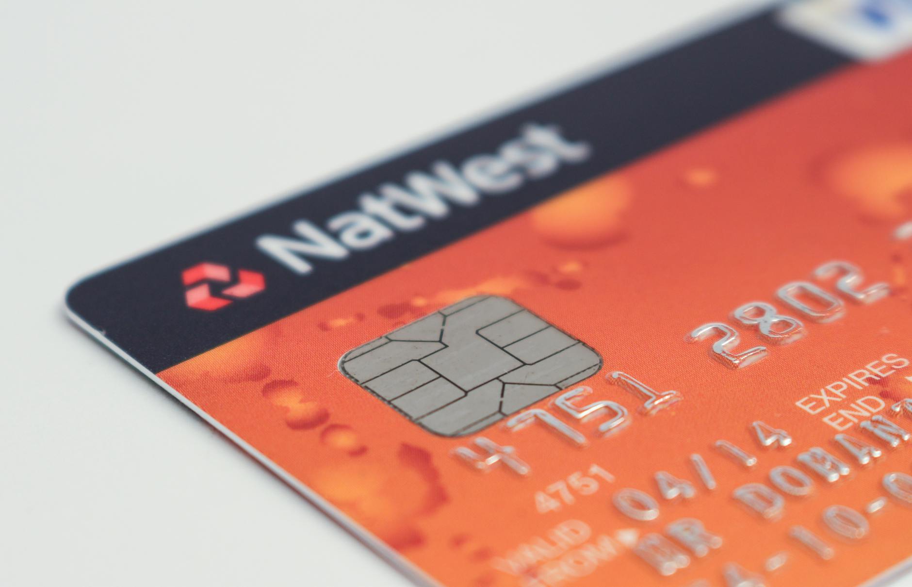 Close-up of a credit card chip highlighting EMV security technology that reduces in-person fraud