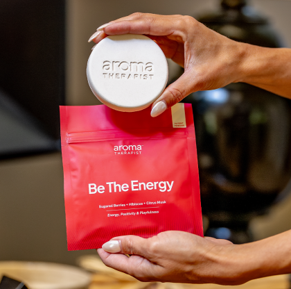 AromaAmplifier AromaPuck scent cartridge detail — biodegradable, flameless, 200+ hour fragrance