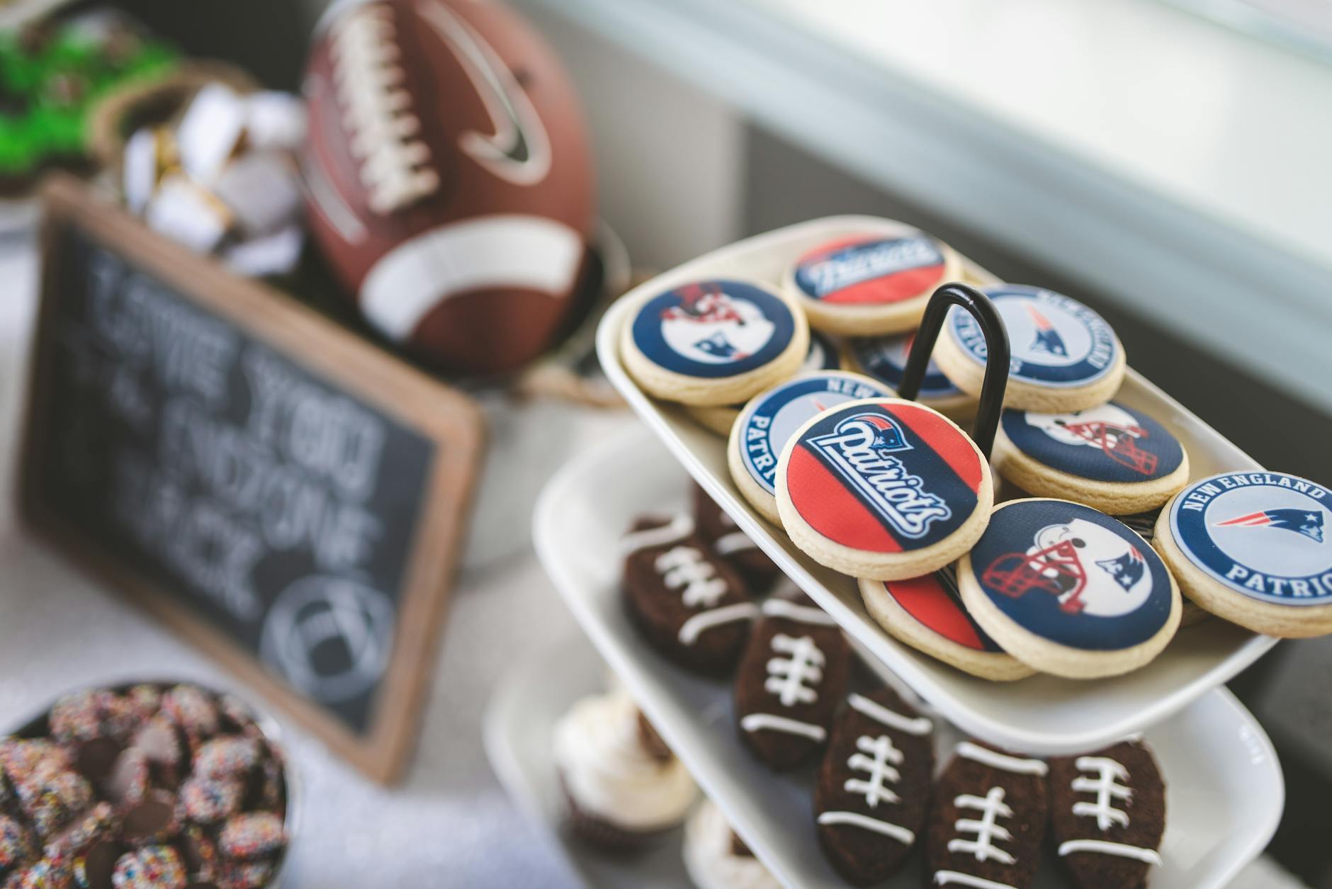 Football tailgate party food spread with snacks and decorations