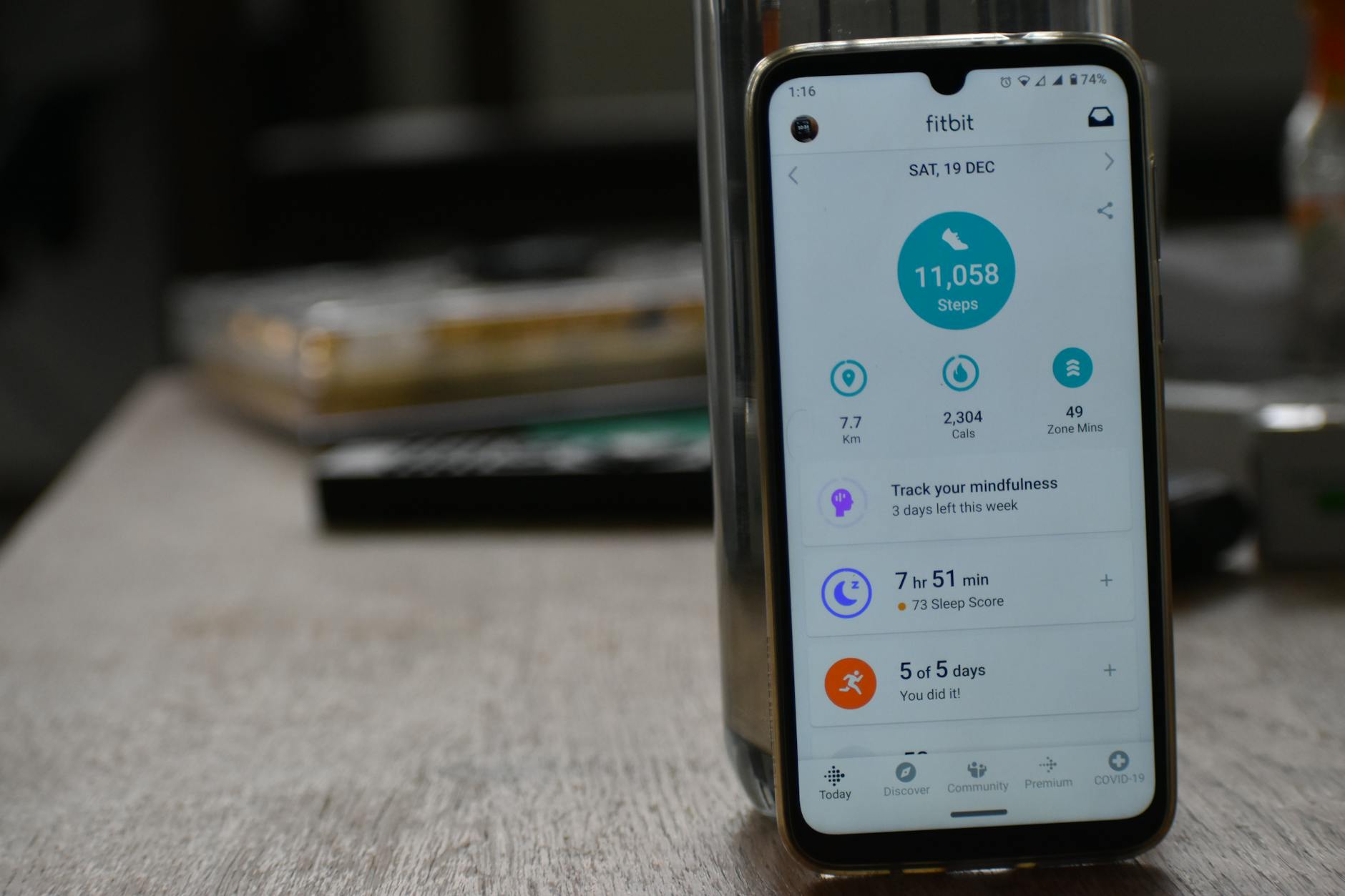Close-up of smartphone displaying a fitness tracking app with workout health statistics