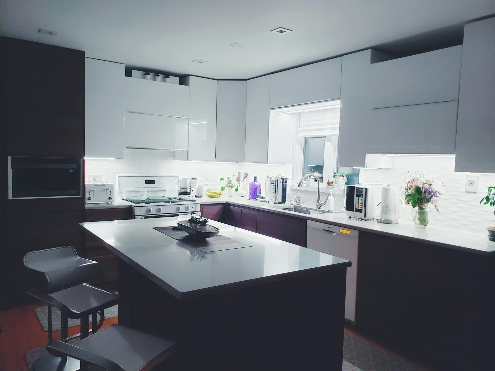 Minimalist Kitchen Workflow Zones Clean minimalist kitchen with white cabinets showing clear workflow zones