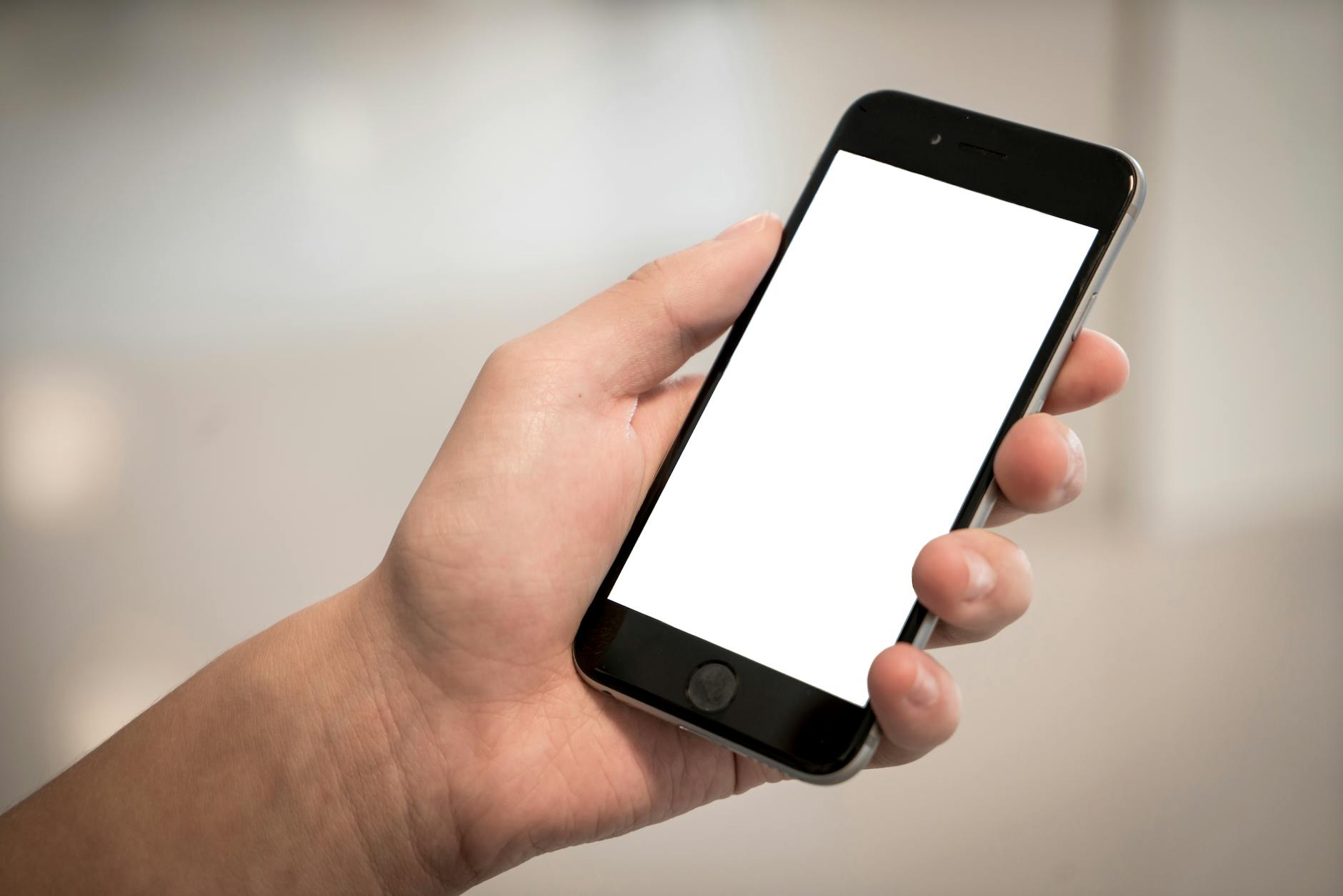 Person holding a smartphone displaying a mobile ticket