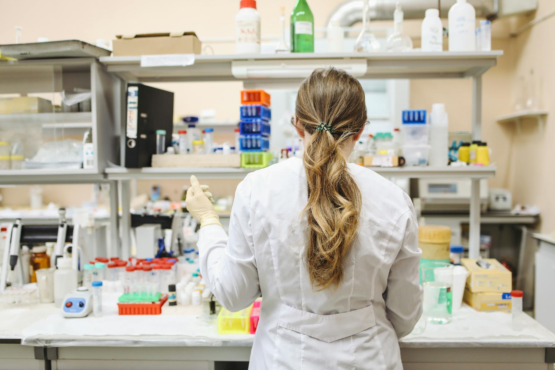 Oral Health Research — Ionic Technology Clinical Studies Female scientist conducting chemical analysis research in a professional laboratory