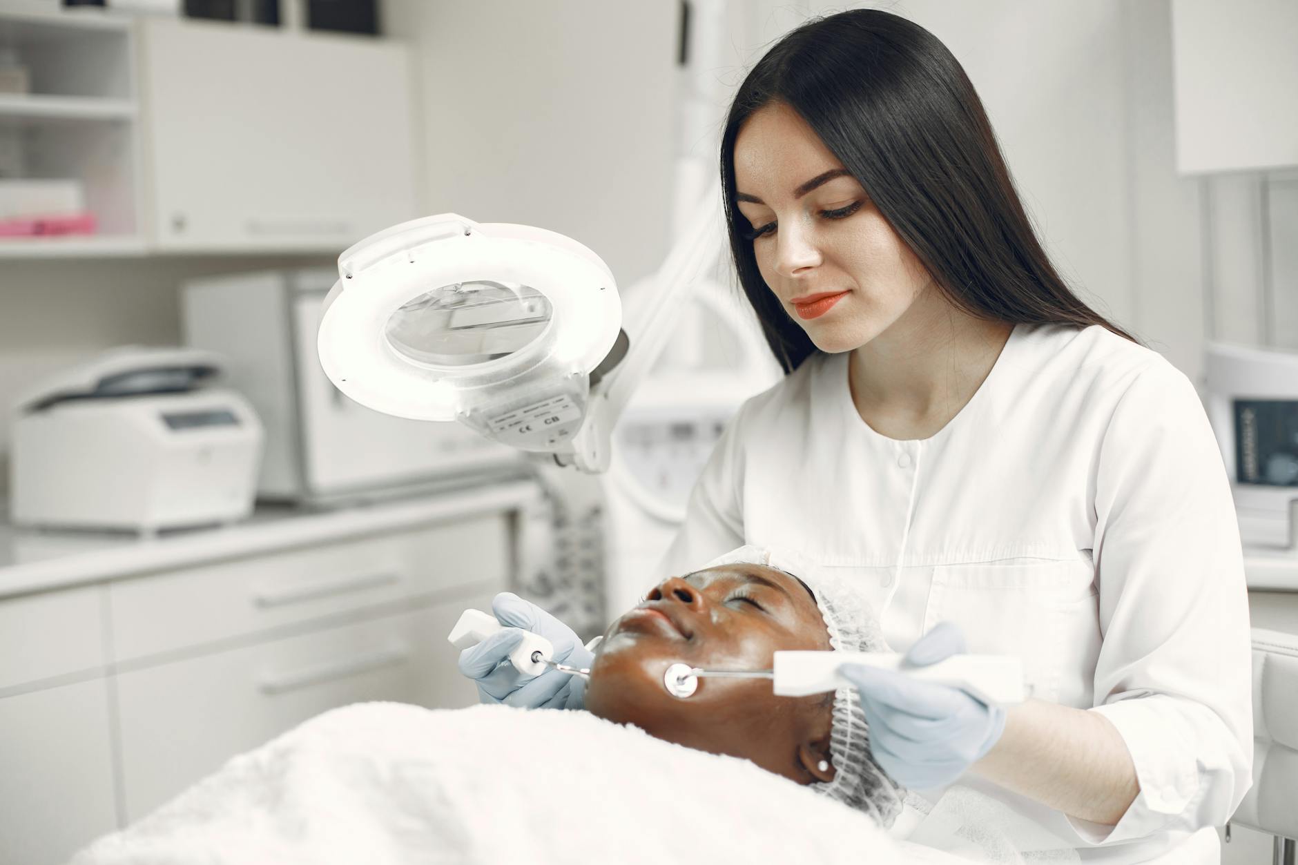 Professional Non-Surgical Skin Tightening Treatment 2026 Dermatologist applying professional skin tightening treatment to a client in a clinical setting