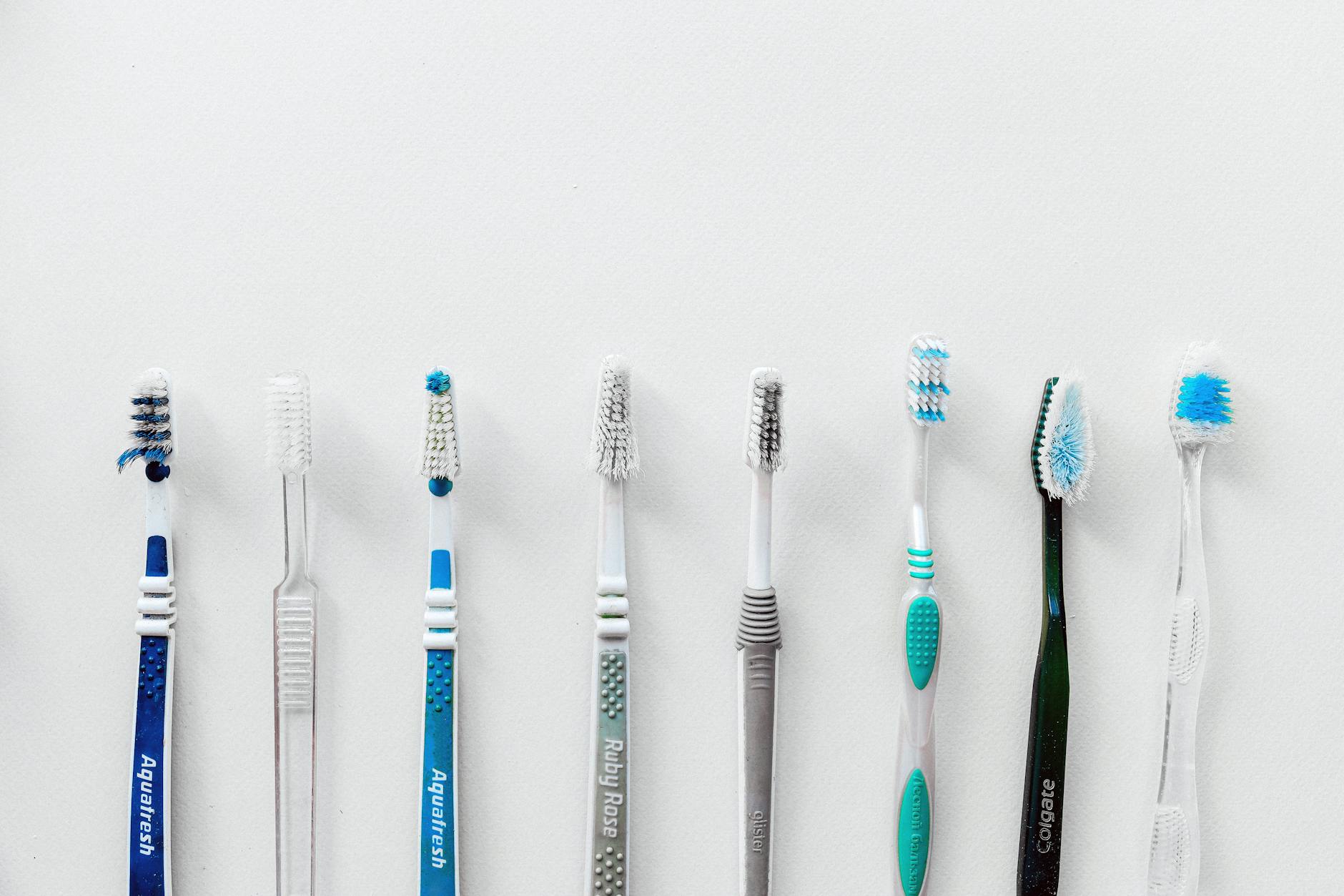 Oral Hygiene Tools and Bacteria Control 2026 Multiple toothbrushes lined up representing different oral hygiene tool choices