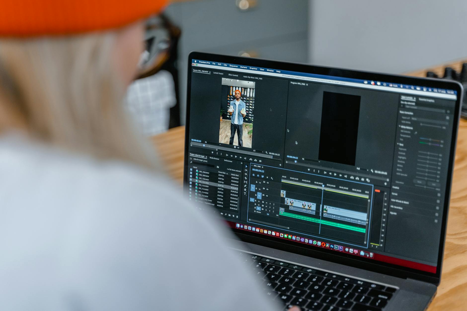 Photo editing and management software displayed on a laptop screen, showing a professional workflow