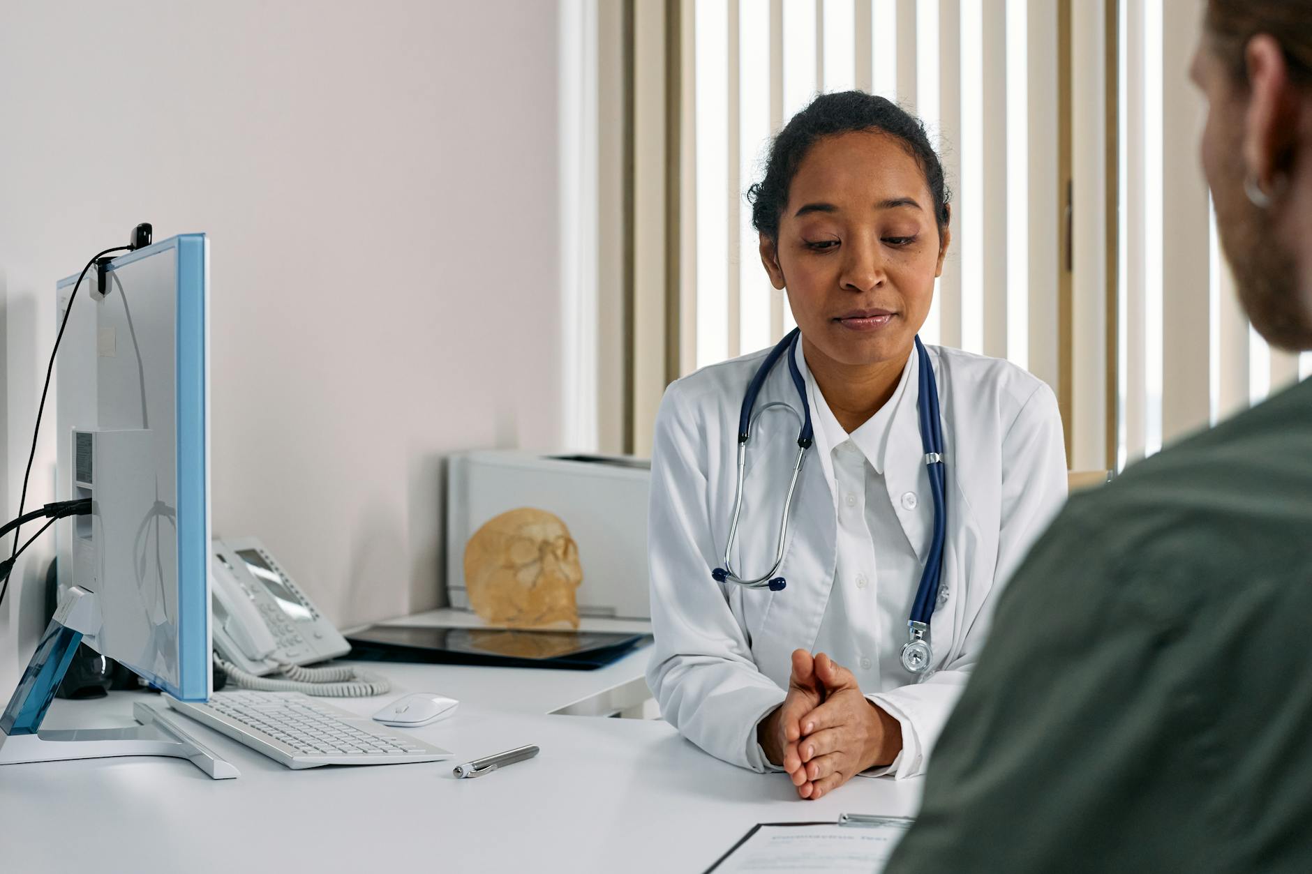 Female doctor consulting with a patient in a medical office about PCOS treatment options