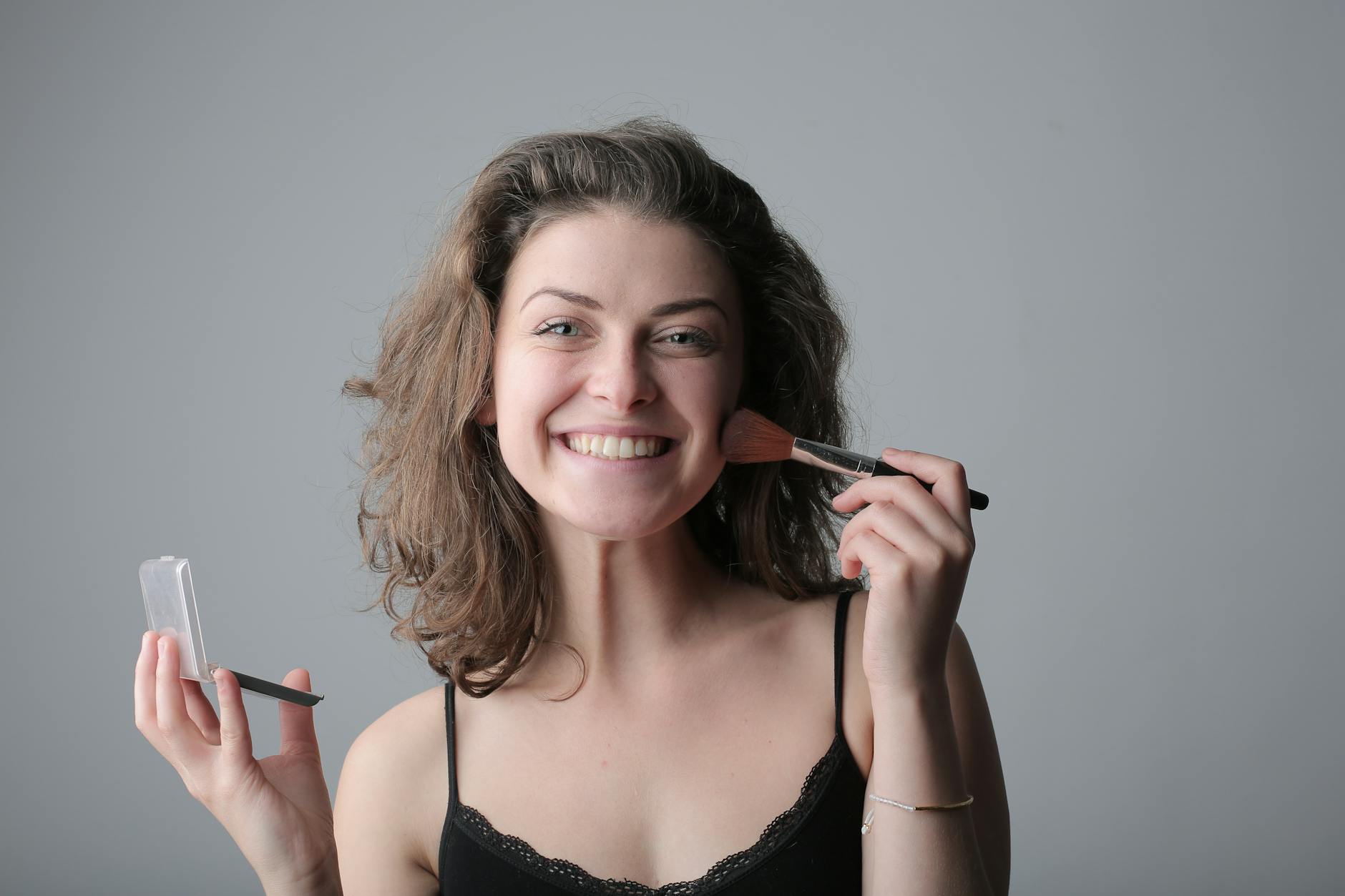 Confident natural skin - whether you remove peach fuzz or not is a personal choice Woman smiling confidently with a natural, glowing complexion