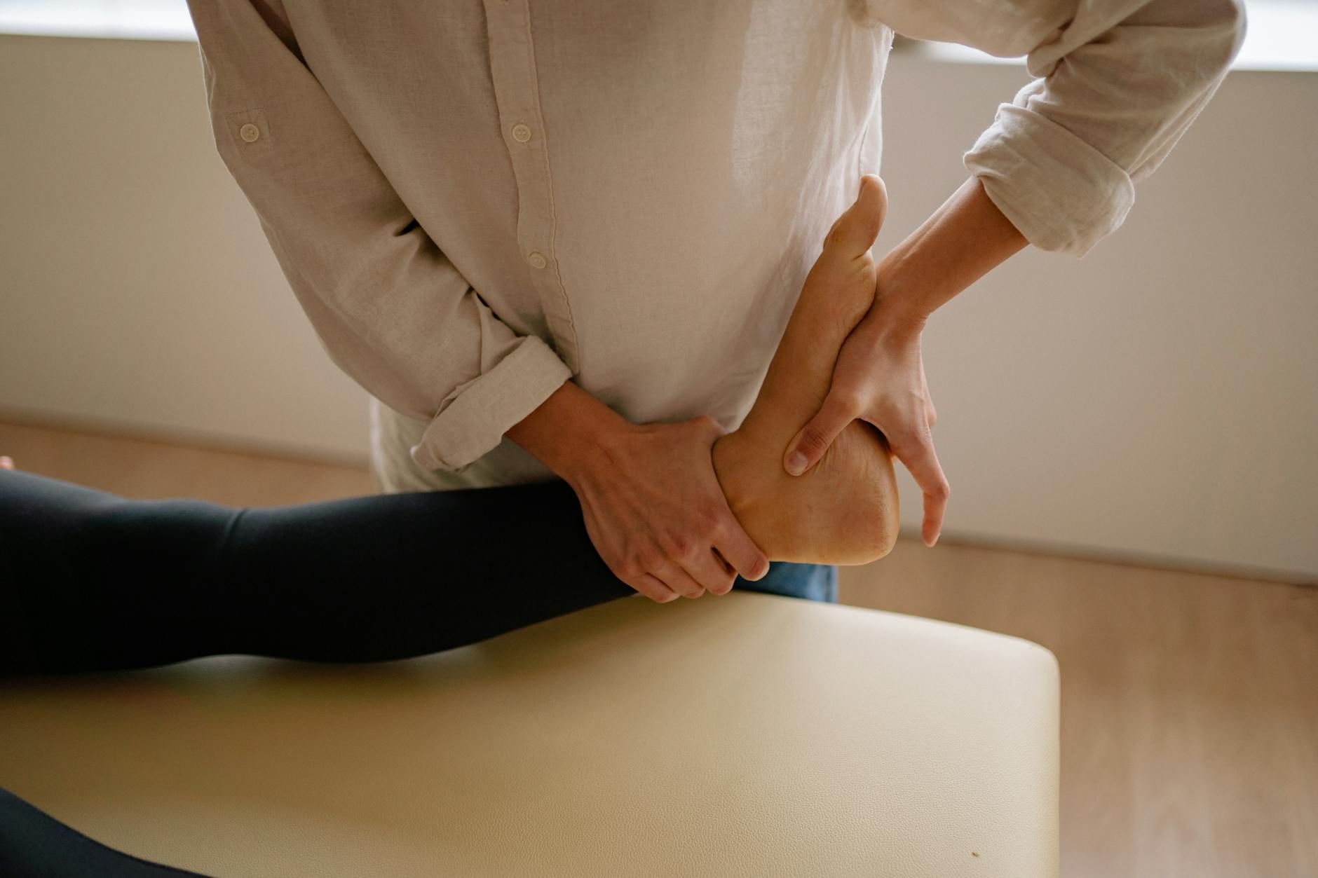Foot Massage Therapy for Neuropathy Relief Close-up of a foot massage, a therapeutic approach used to relieve nerve pain and tingling