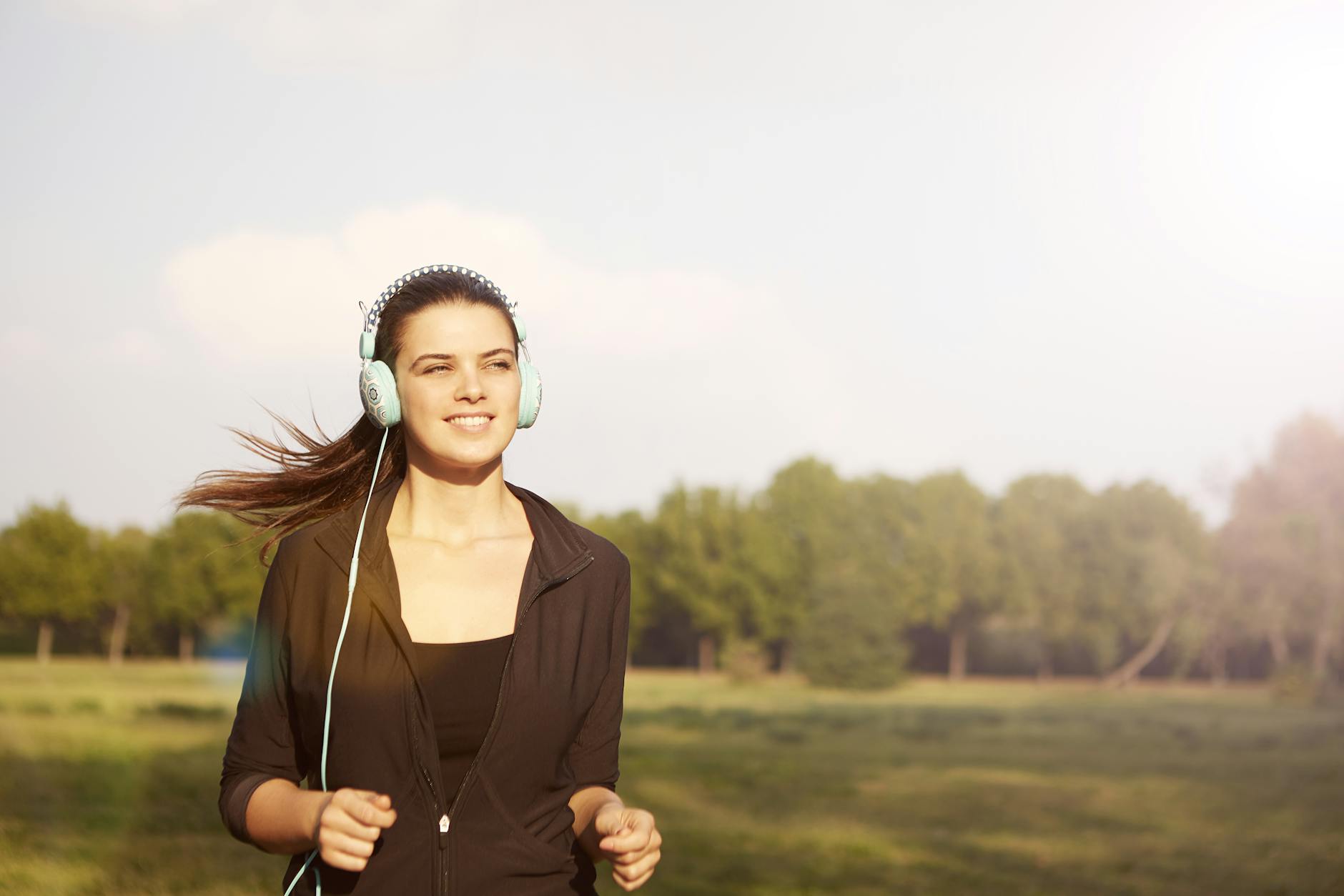 Regular aerobic exercise is one of the most effective ways to improve blood flow to the legs Woman jogging outdoors to improve circulation in feet and legs