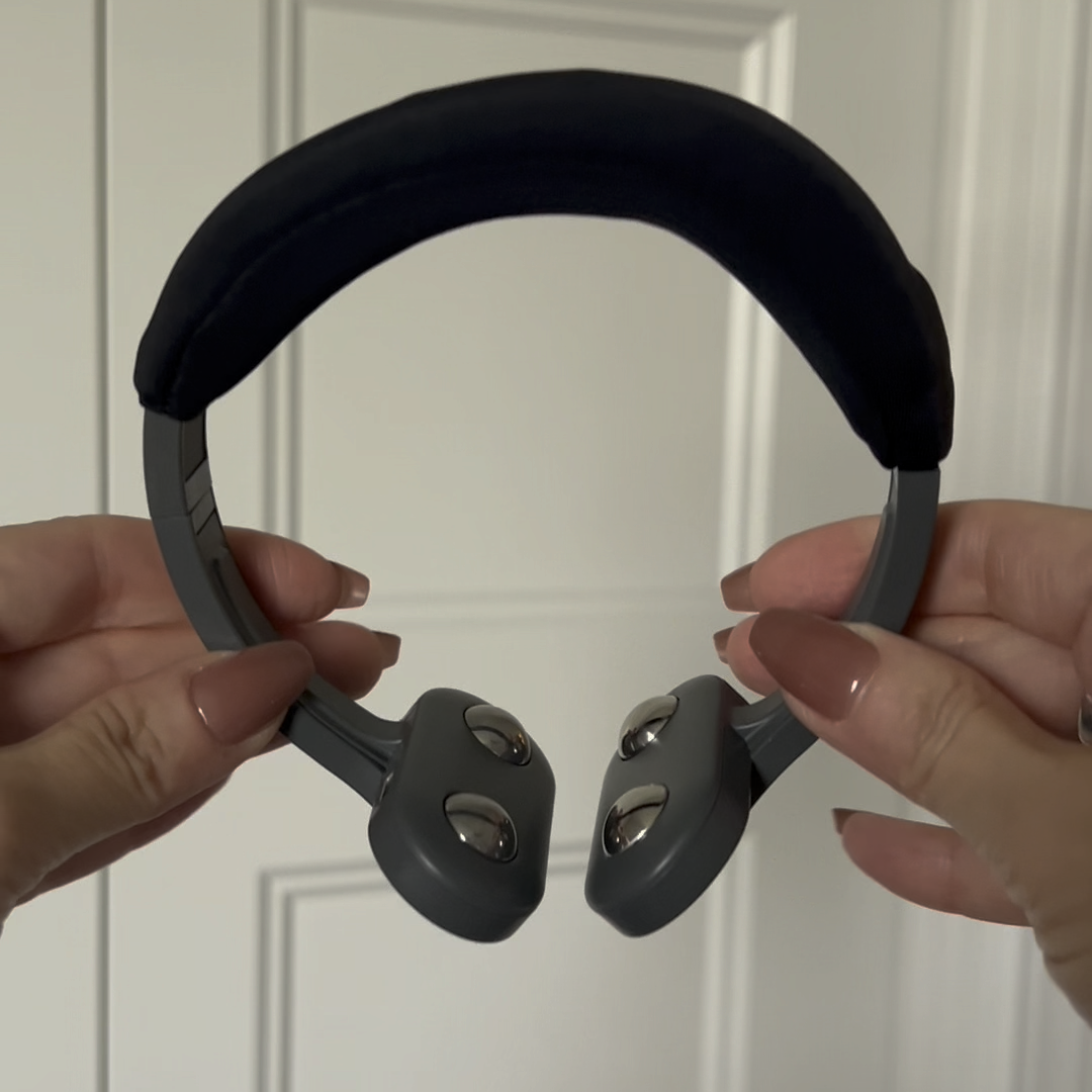 Pulsetto vagus nerve stimulator device on white background showing the arc design and contact points