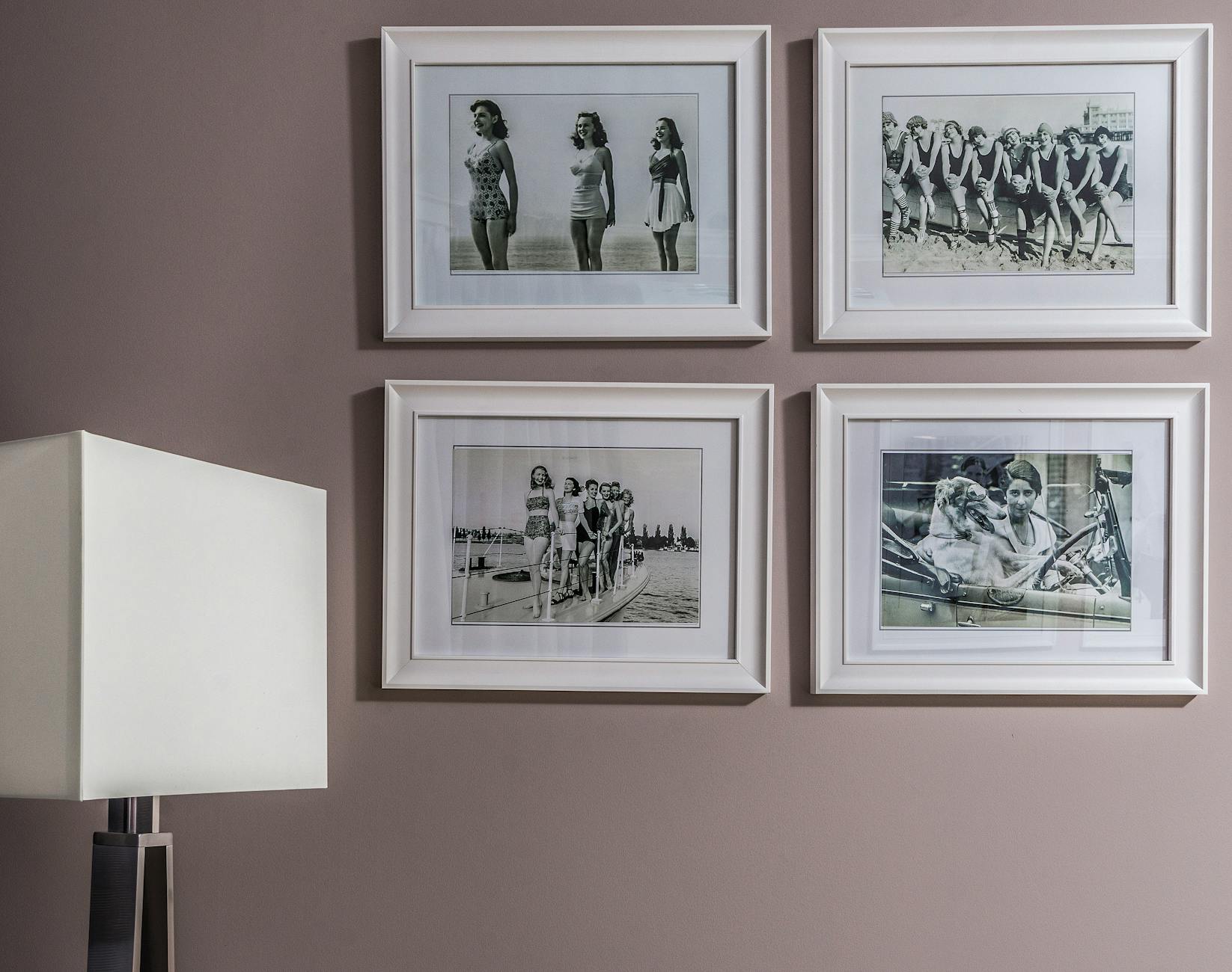 Vintage black and white framed photos displayed on a wall — a timeless way to share family memories